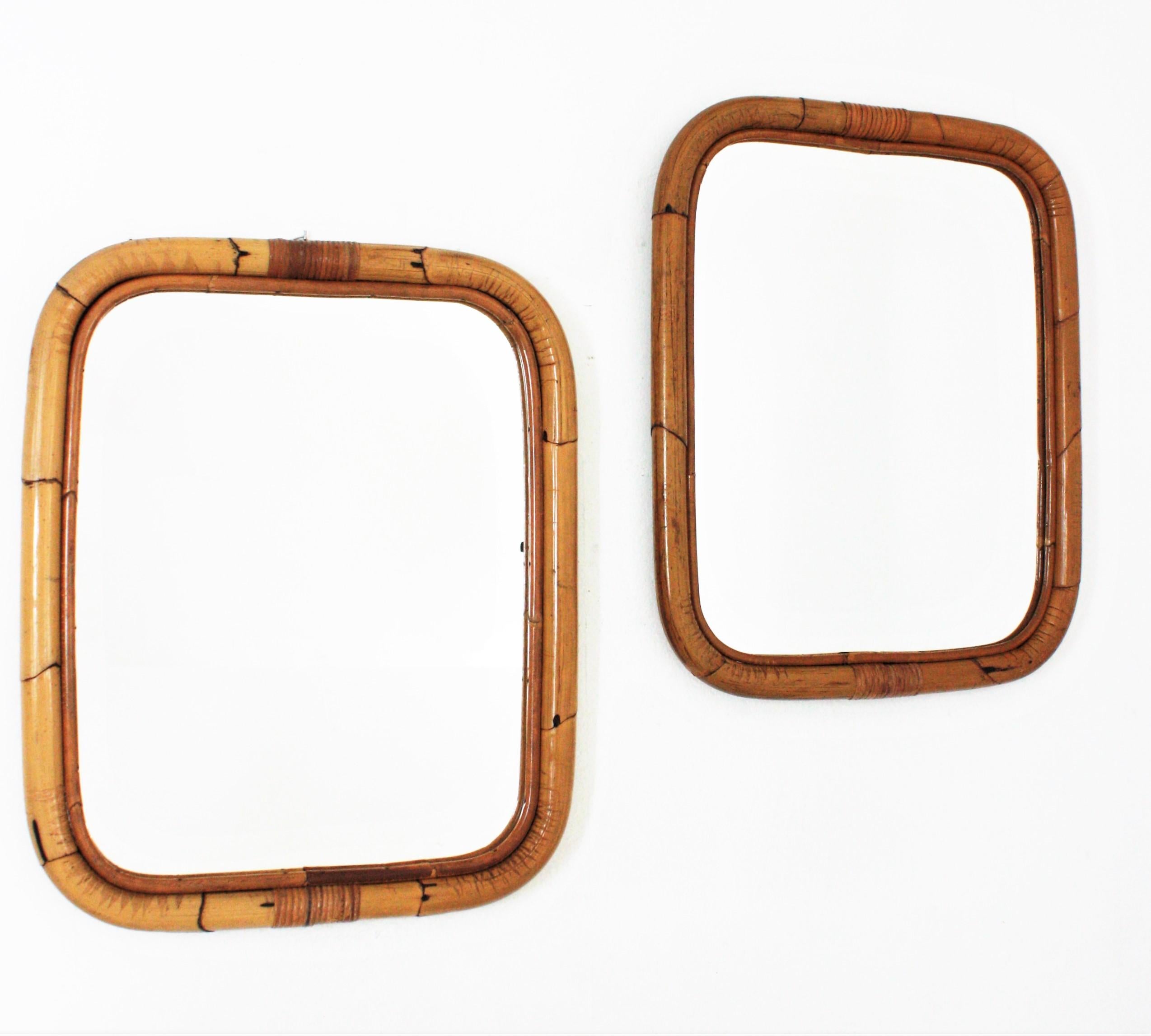 Pair of Rectangular wall mirrors, bamboo, rattan
Eye-catching pair of rectangular mirrors handcrafted with bamboo cane. Spain, 1960s.
Rectangular frames made of bamboo with rounded corners. 
These mirrors are in excellent vintage condition.
They