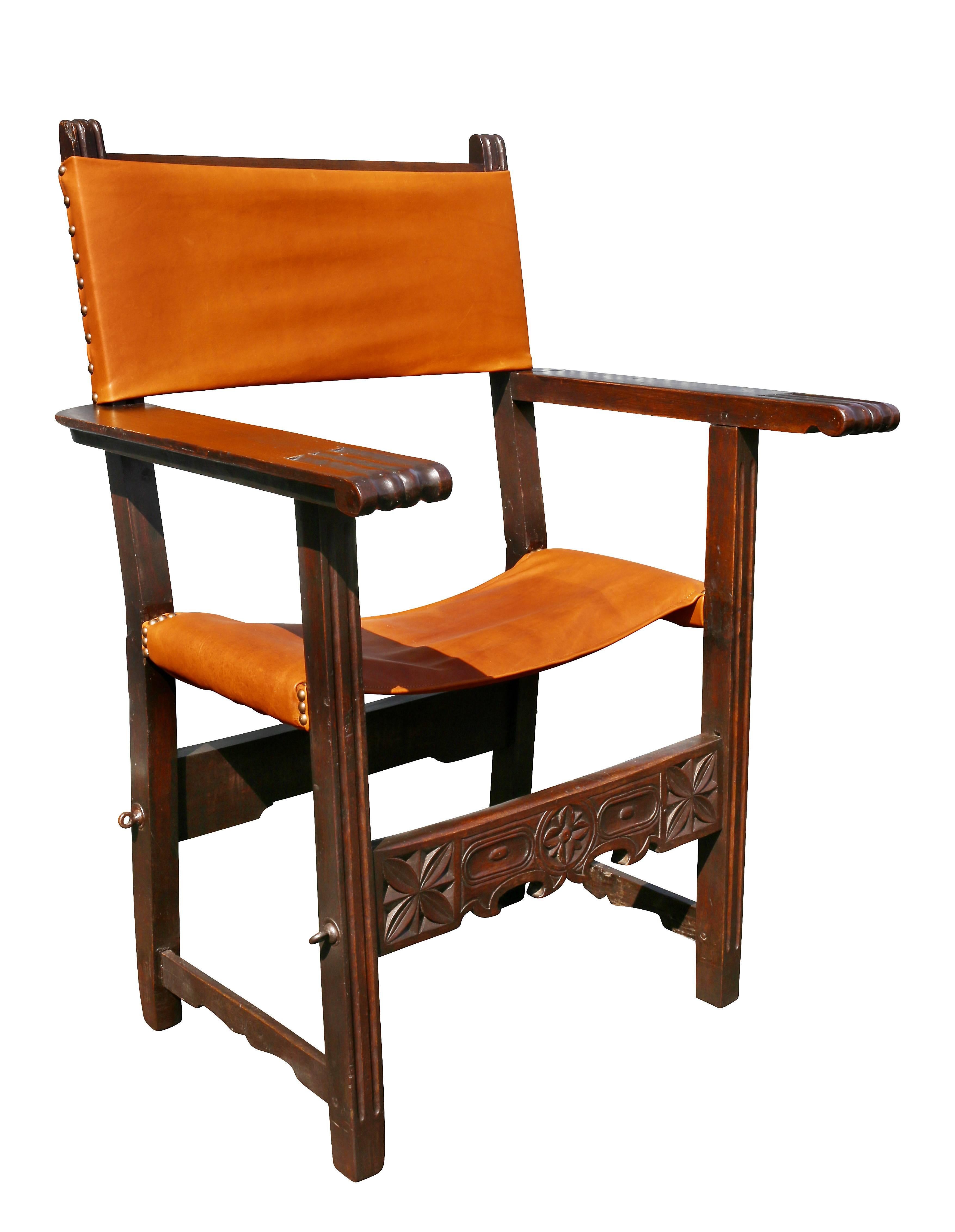 With new leather seat and back, flat arms and carved stretchers. Provenance; Fogg Estate, Chestnut Hill Ma.