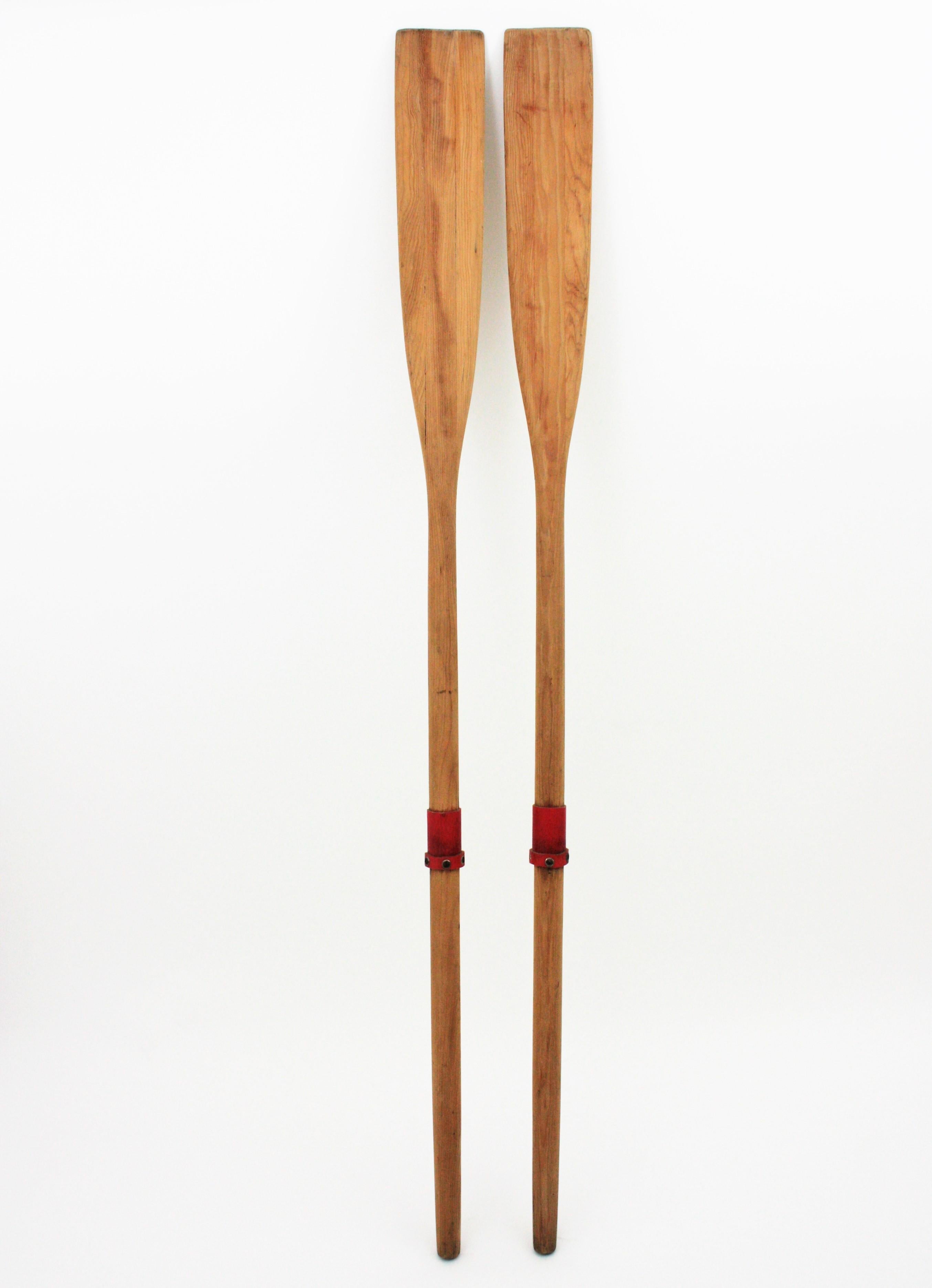 Hand carved pine wood boat oars from a Costa Brava rowboat. Spain, 1940s.
These steering paddles will be eye-catching used for decoratives purposes as wall decoration or ready to use in an small vintage rowboat.
Strong and sound.
You can add a