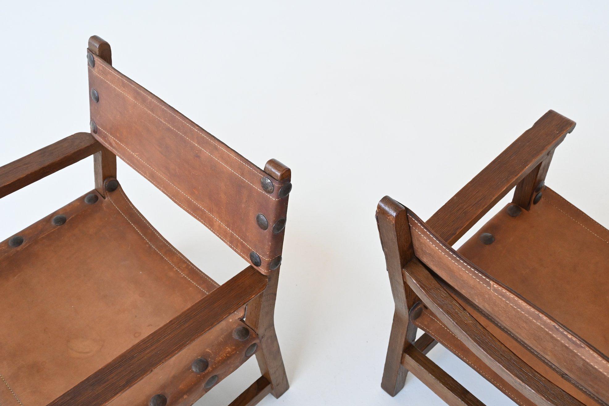 Pair of Spanish brutalist lounge chairs oak and saddle leather Spain 1960 4