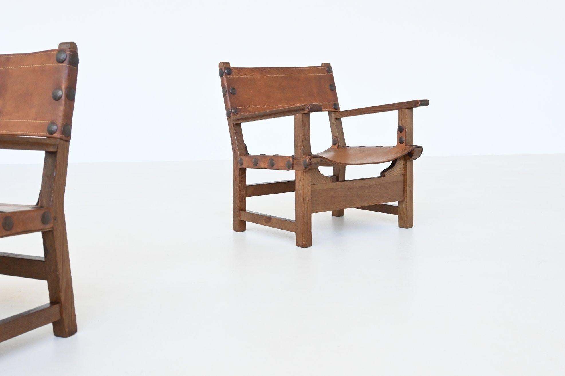 Pair of Spanish brutalist lounge chairs oak and saddle leather Spain 1960 5