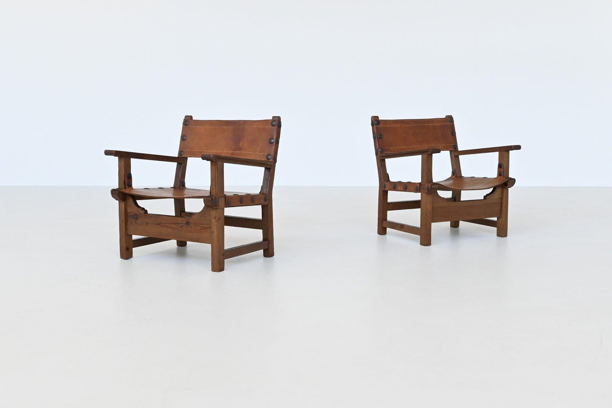 Pair of Spanish brutalist lounge chairs oak and saddle leather Spain 1960 In Good Condition In Etten-Leur, NL