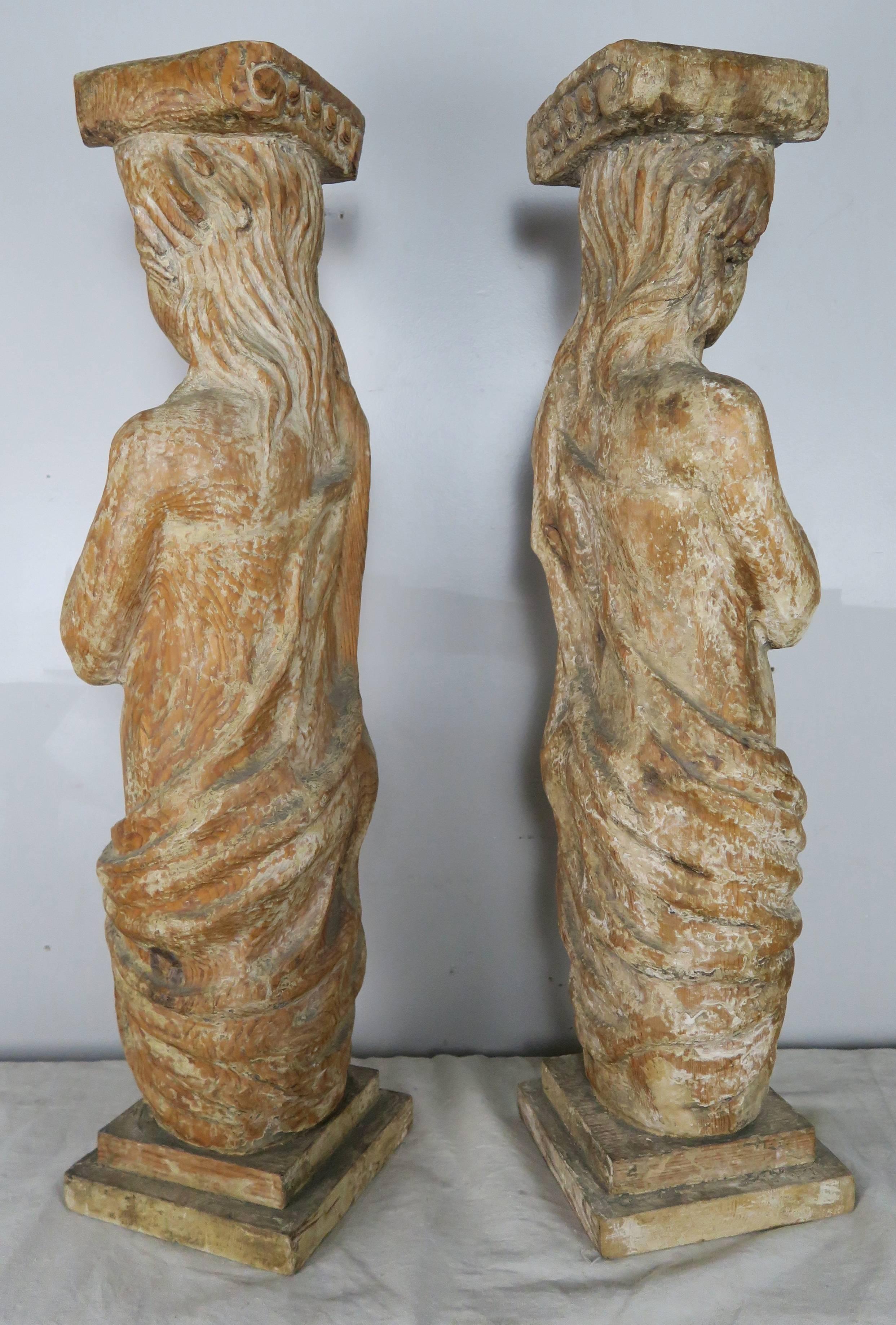 Pair of Spanish Carved Wood Figural Pedestals In Distressed Condition In Los Angeles, CA