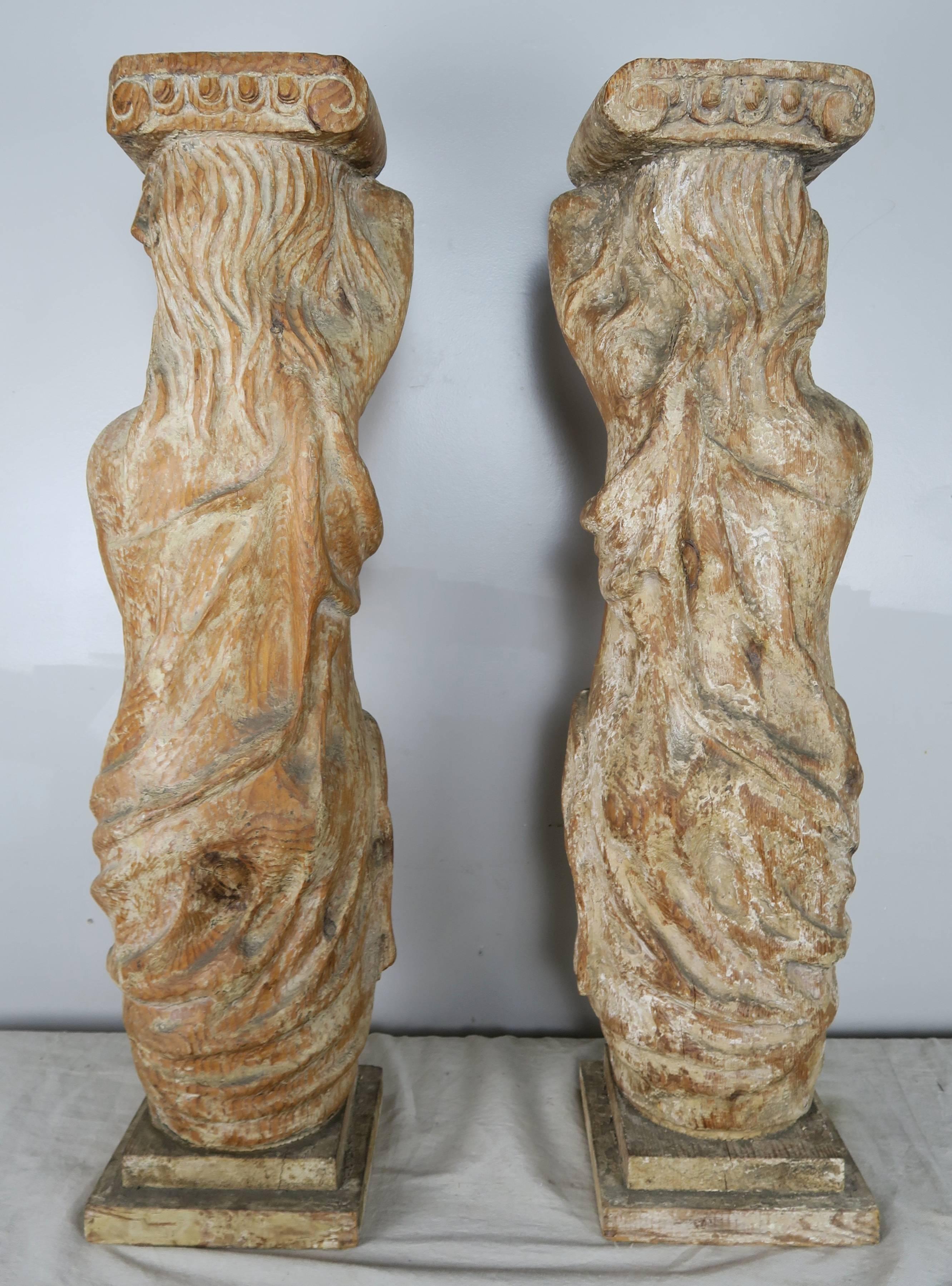 Early 20th Century Pair of Spanish Carved Wood Figural Pedestals