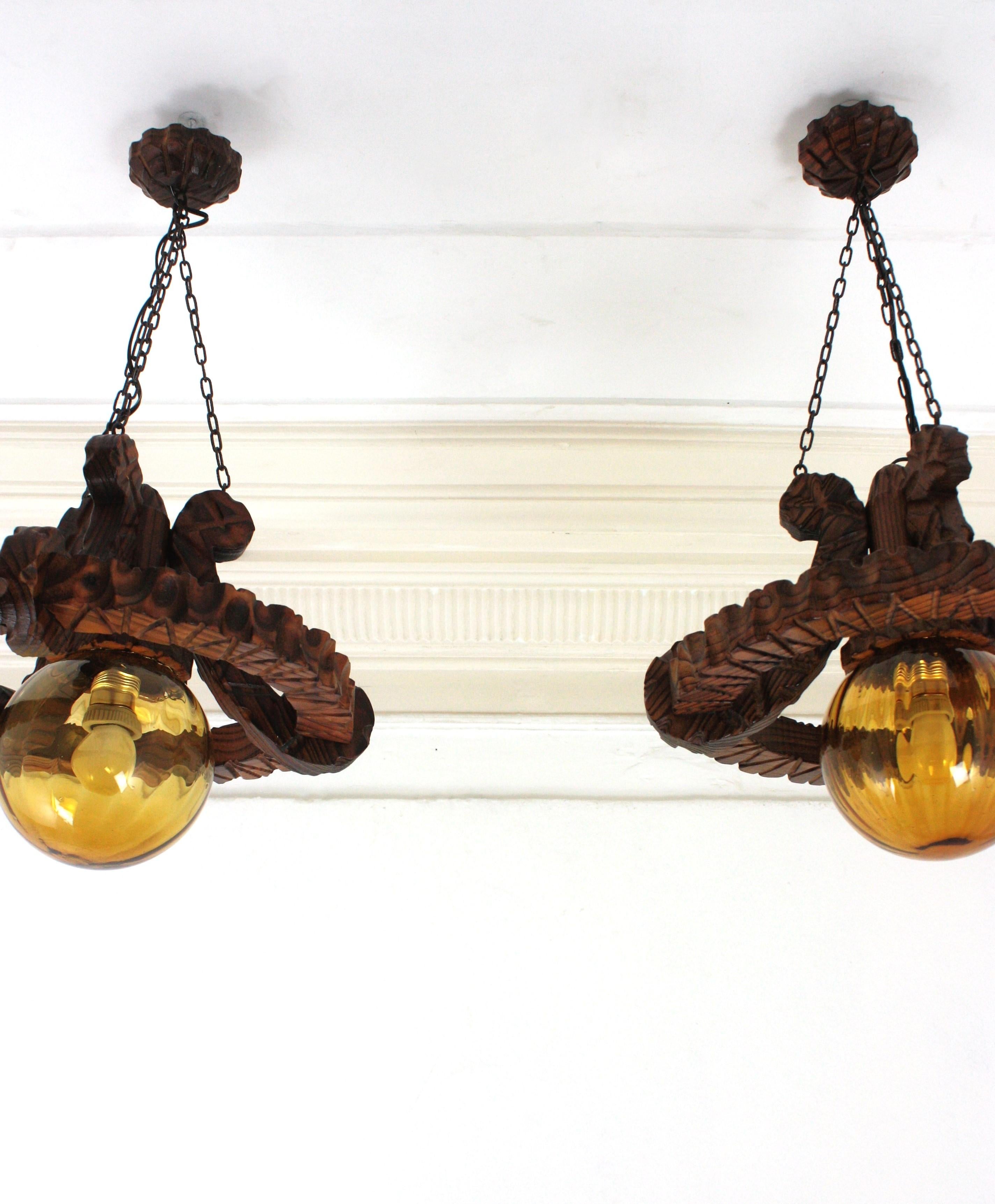 Pair of Spanish Colonial Pendants / Light Fixtures in Carved Wood & Amber Glass For Sale 7