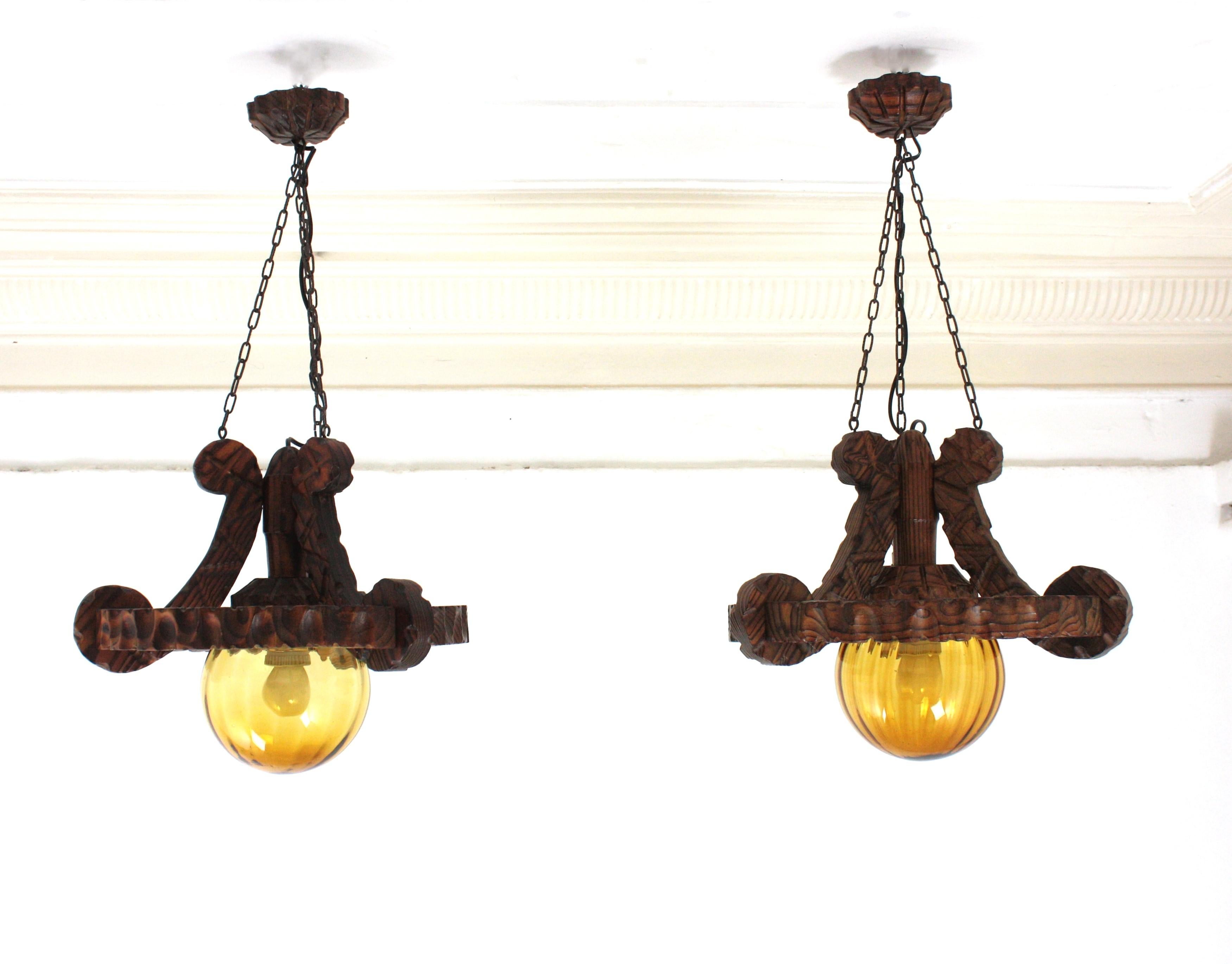 Pair of Spanish Colonial Pendants / Light Fixtures in Carved Wood & Amber Glass For Sale 8