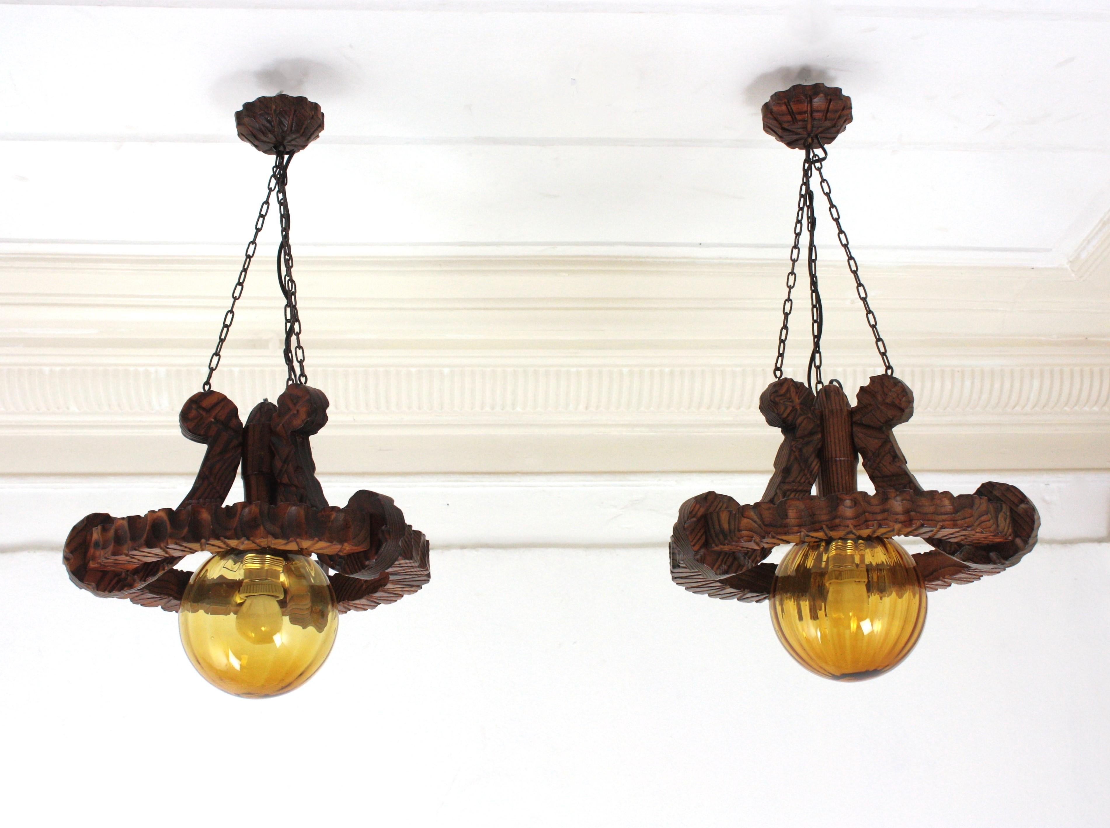 Pair of Spanish Colonial Pendants / Light Fixtures in Carved Wood & Amber Glass For Sale 9