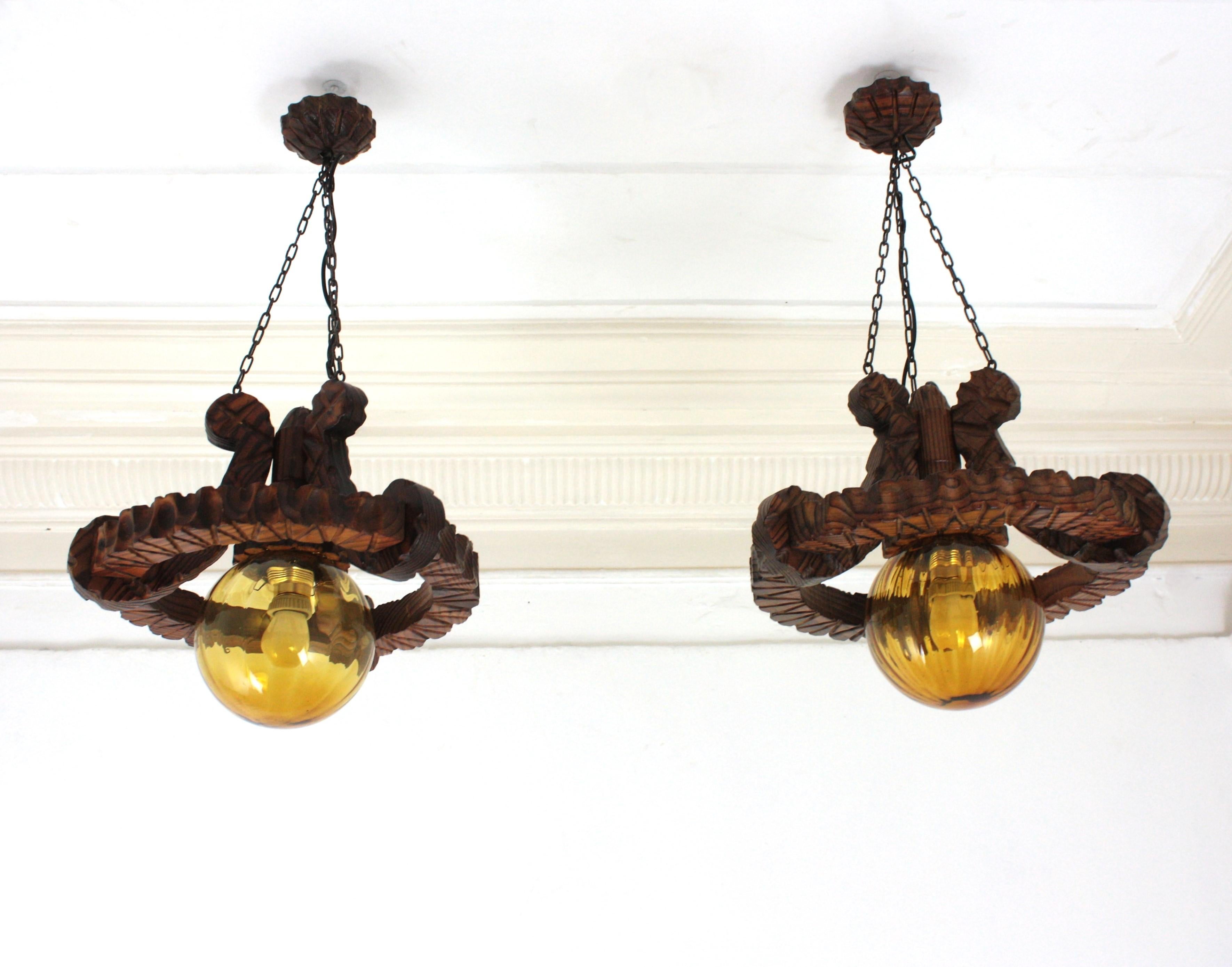 Pair of Spanish Colonial Pendants / Light Fixtures in Carved Wood & Amber Glass For Sale 10