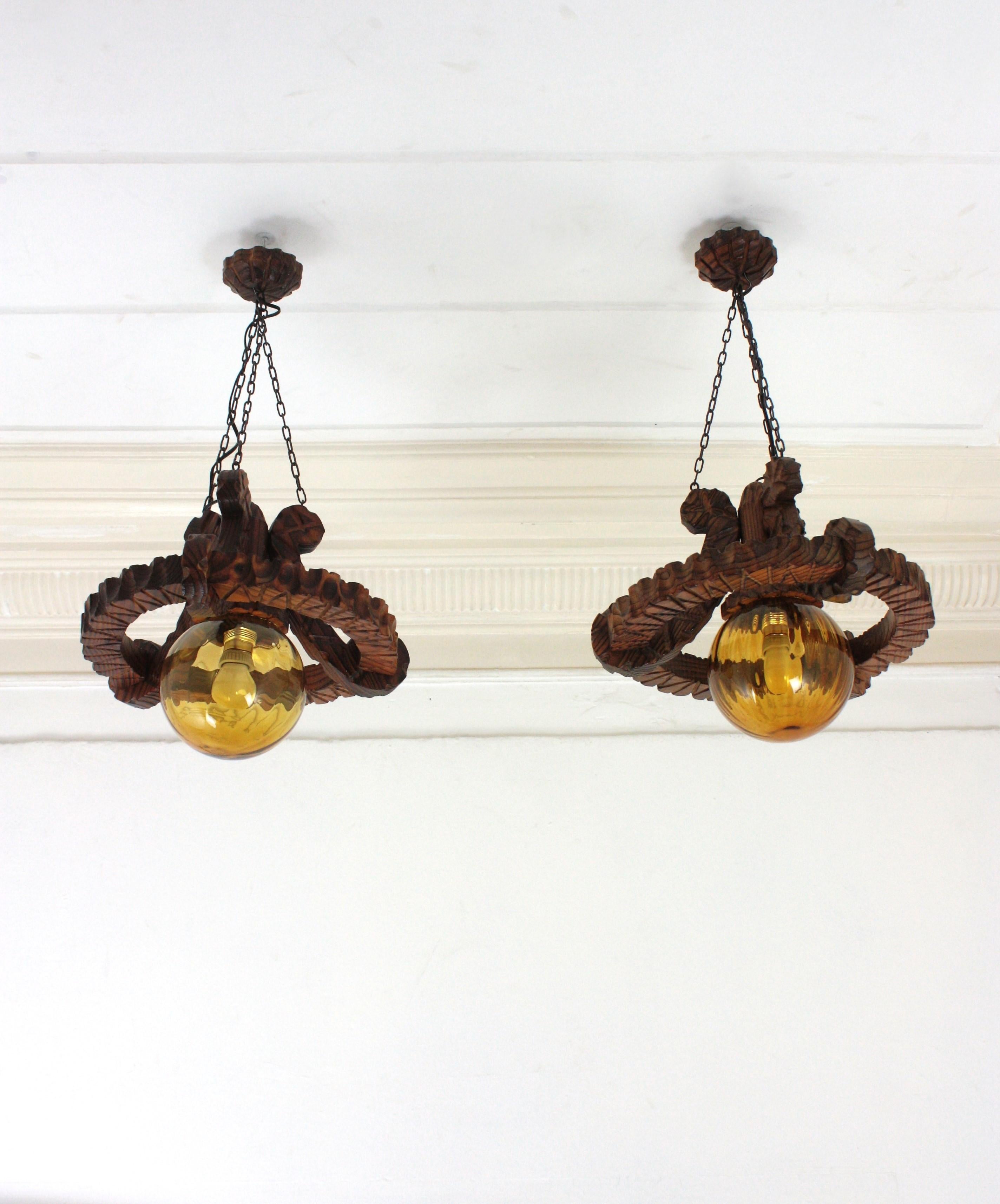 Pair of Spanish Colonial Pendants / Light Fixtures in Carved Wood & Amber Glass For Sale 2