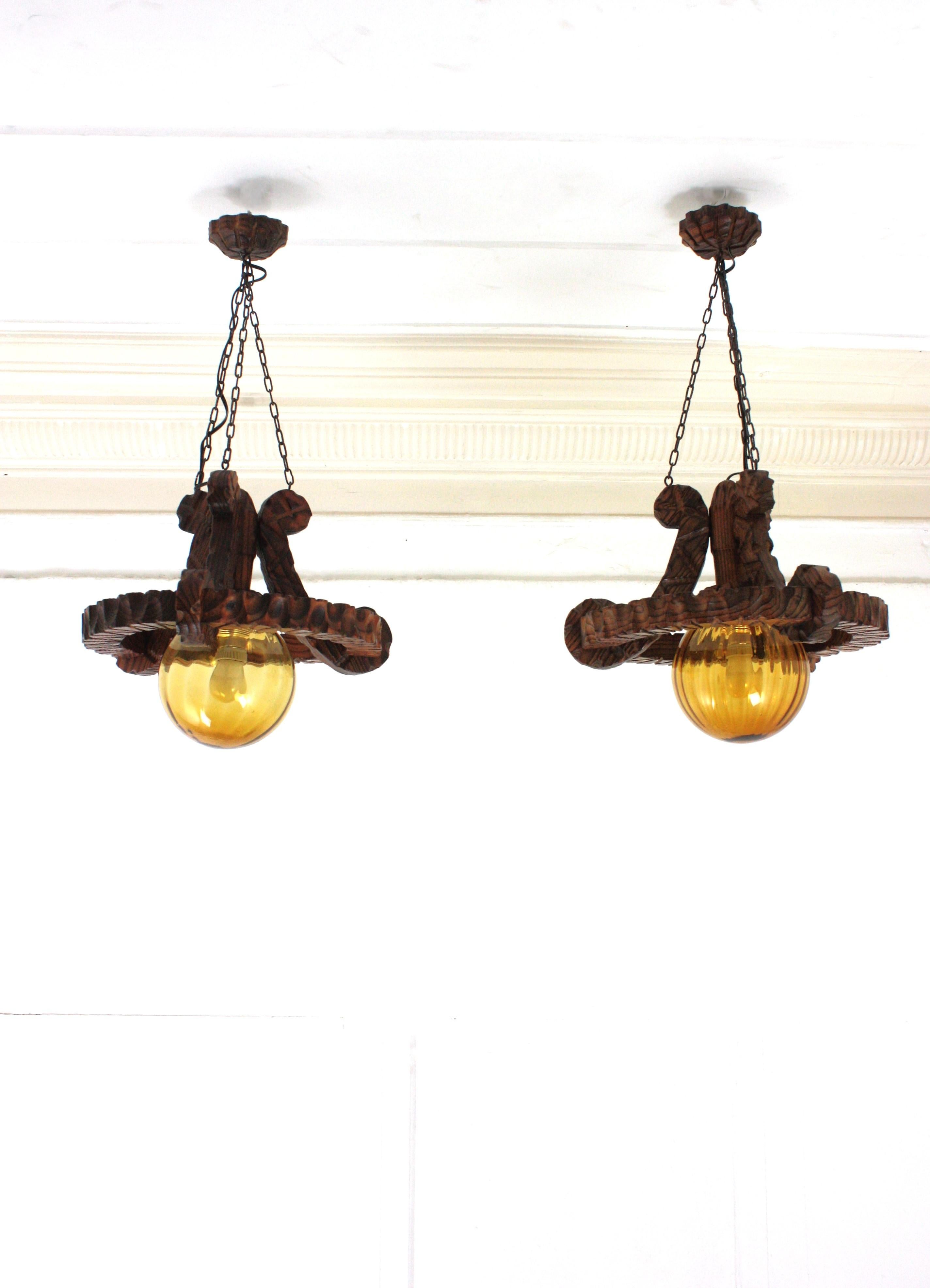 Pair of Spanish Colonial Pendants / Light Fixtures in Carved Wood & Amber Glass For Sale 3
