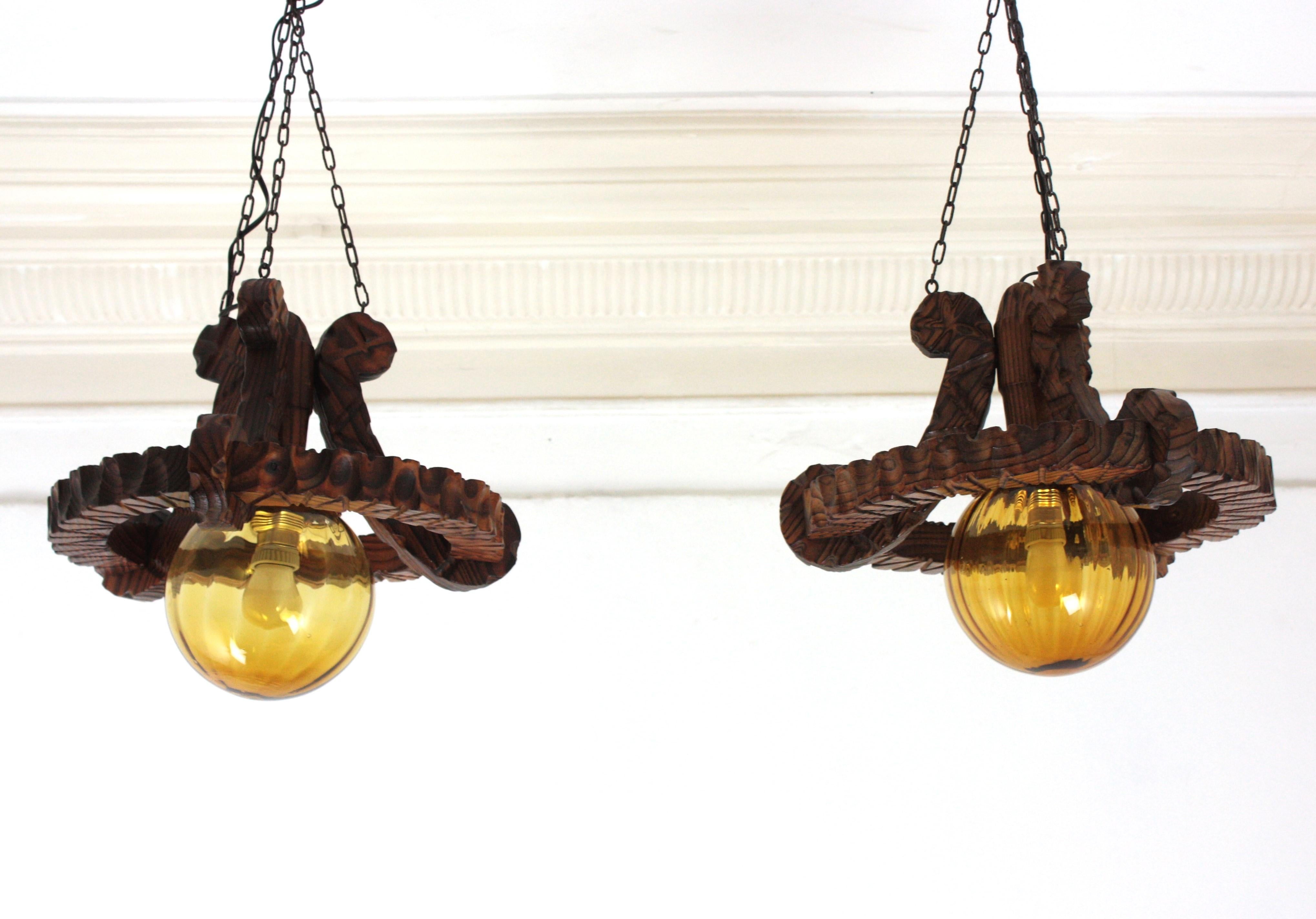 Pair of Spanish Colonial Pendants / Light Fixtures in Carved Wood & Amber Glass For Sale 4