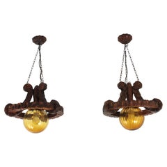 Pair of Spanish Colonial Pendants / Light Fixtures in Carved Wood & Amber Glass Pair of Spanish Colonial Pendants / Light Fixtures in Carved Wood & Amber Glass