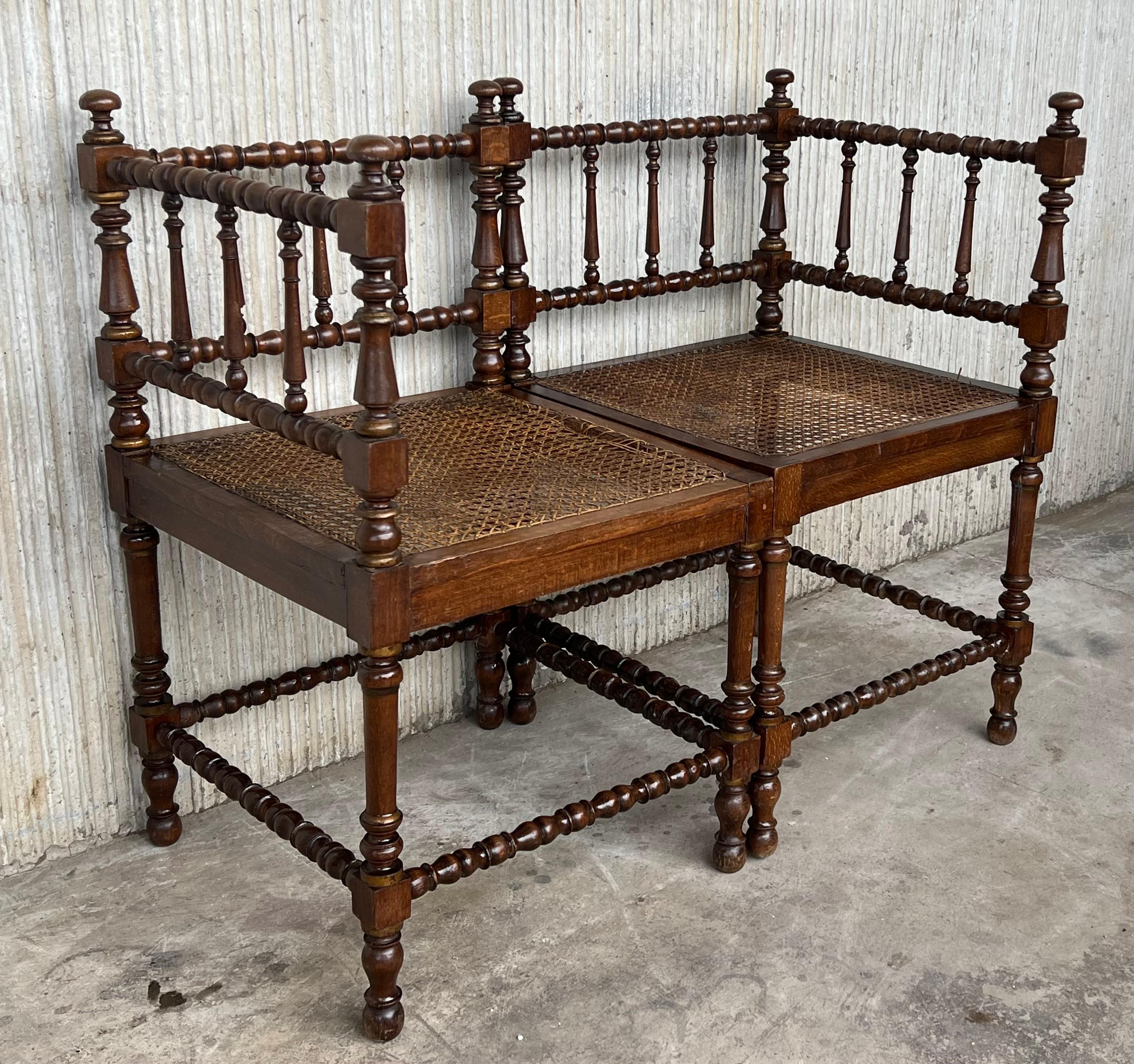 Spanish Colonial Pair of Spanish Corner Turned Armchairs Shaping a Bench with Cane Seat