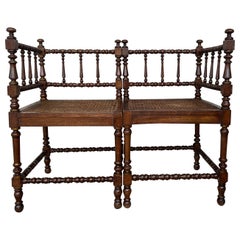Pair of Spanish Corner Turned Armchairs Shaping a Bench with Cane Seat