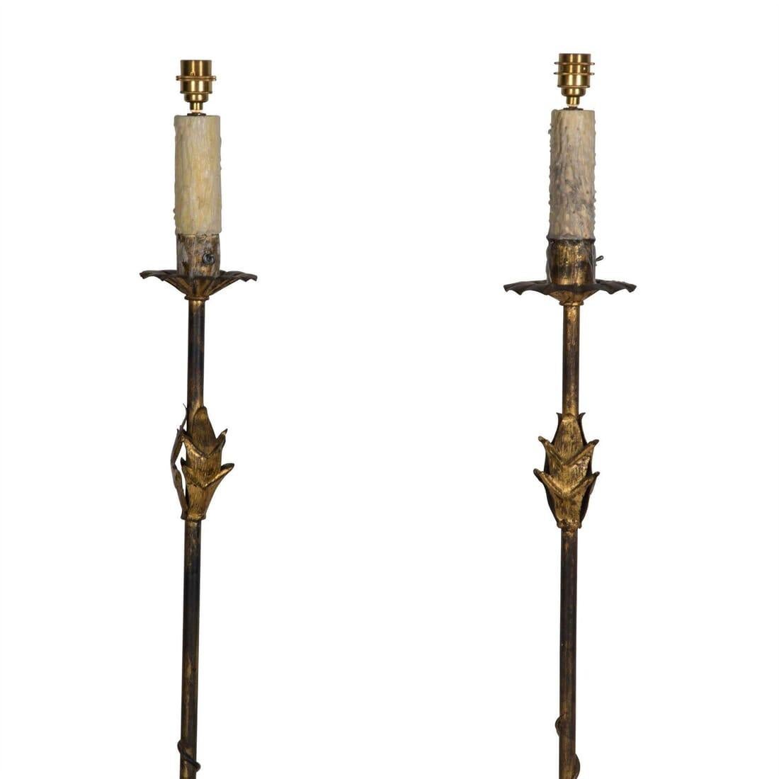 A pair of 20th century Spanish gilded wrought iron floor lamps.

These proud floor lamps emit the raw and fine detail of metal that has been smithed and hand-forged by a once-talented tradesman.

Please note that shades are not included.