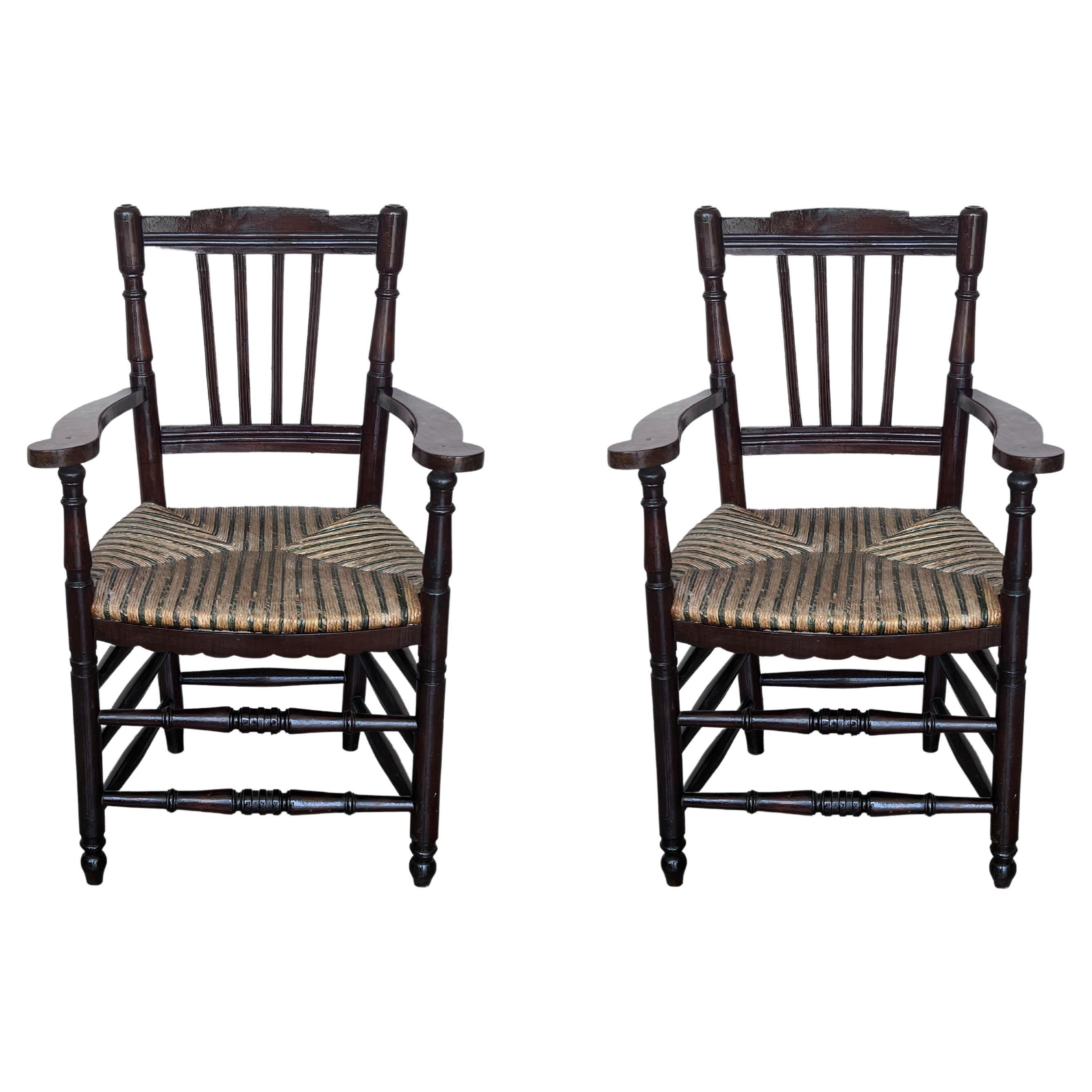 Pair of Spanish Horseshoe Back and Cane Armchairs