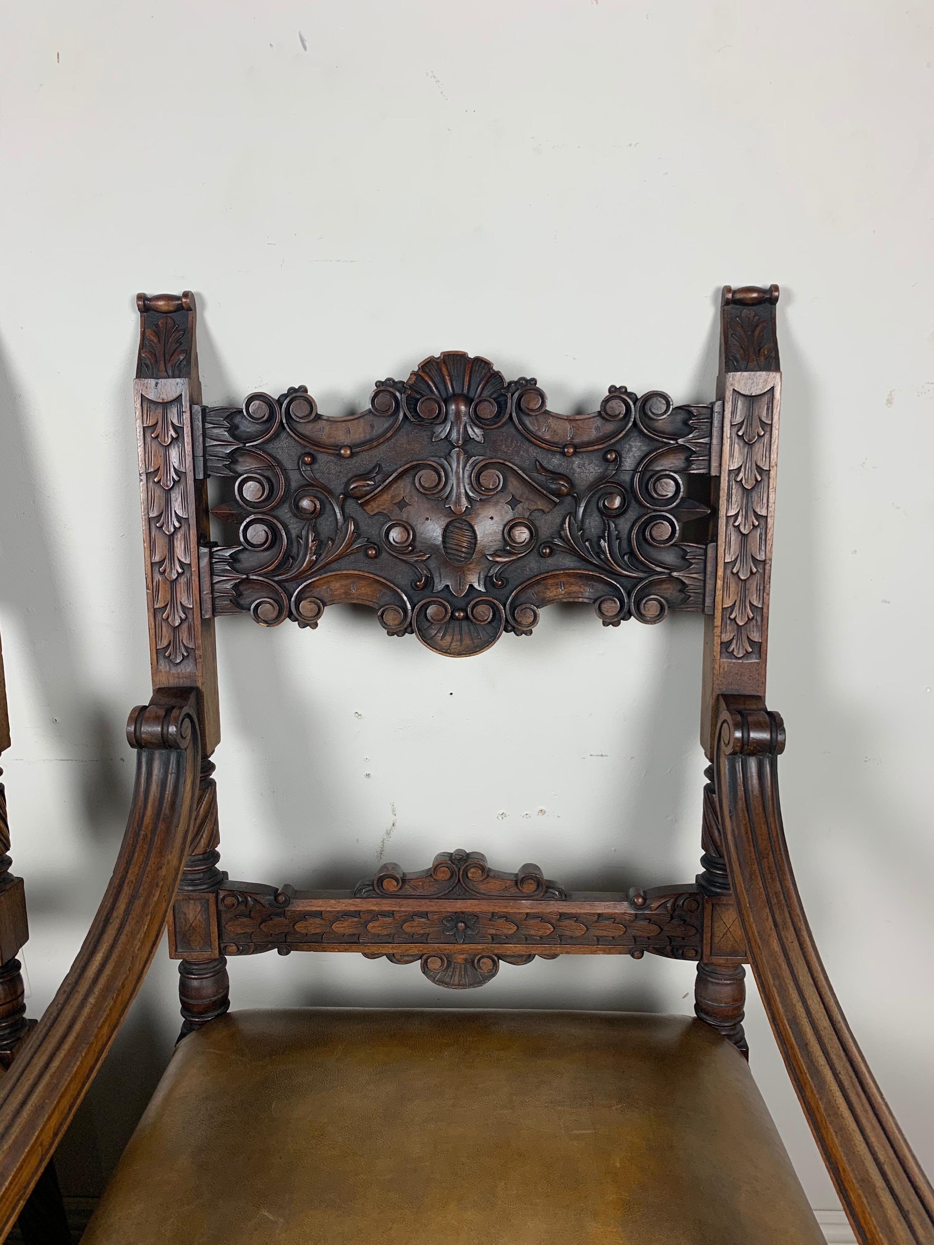 Hand-Carved Pair of Spanish Leather Upholstered Armchairs