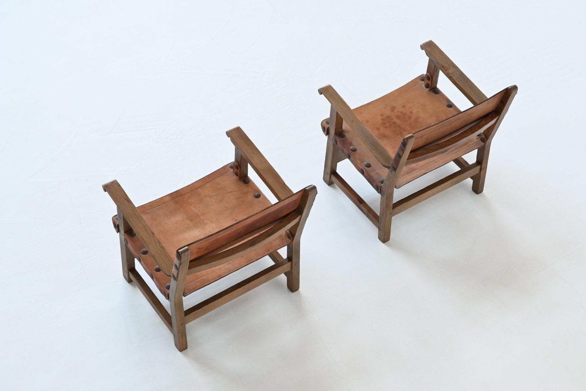 Pair of Spanish lounge chairs oak and saddle leather Spain 1960 In Good Condition For Sale In Etten-Leur, NL