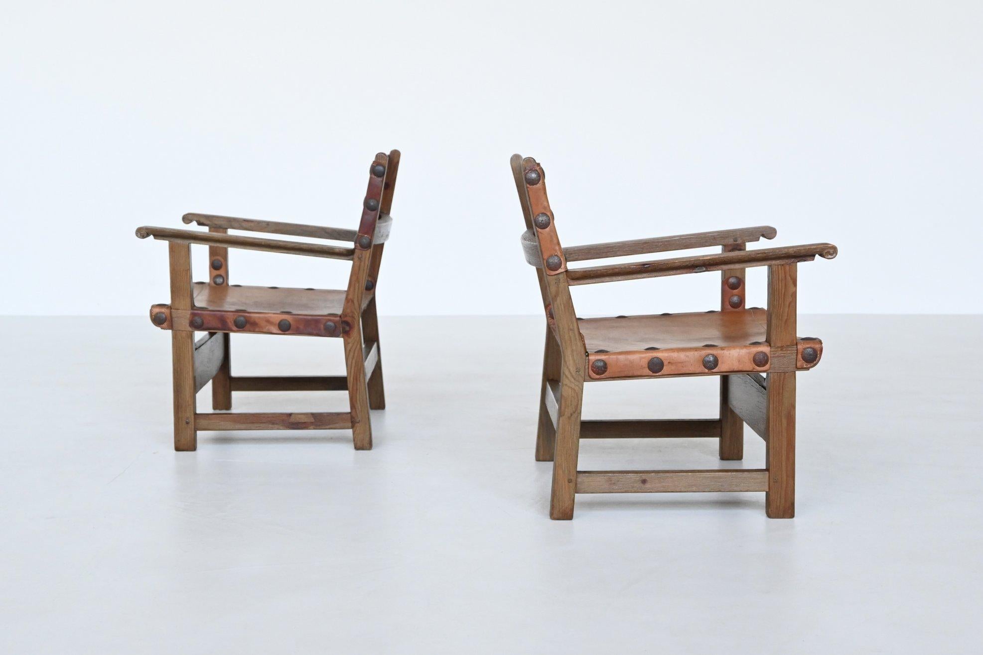 Mid-20th Century Pair of Spanish lounge chairs oak and saddle leather Spain 1960 For Sale