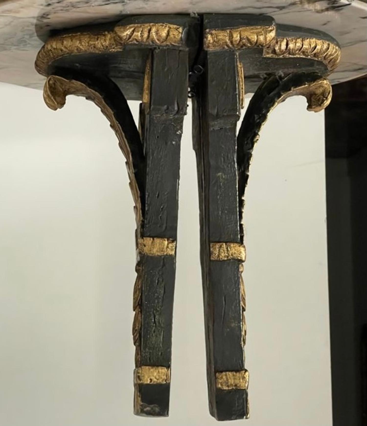 Pair of Spanish wall brackets, neoclassical period, in carved and gilded wood, in contrast to ebonized wood, decoration of plant and geometric motifs, perfect to put objects or vases on them.