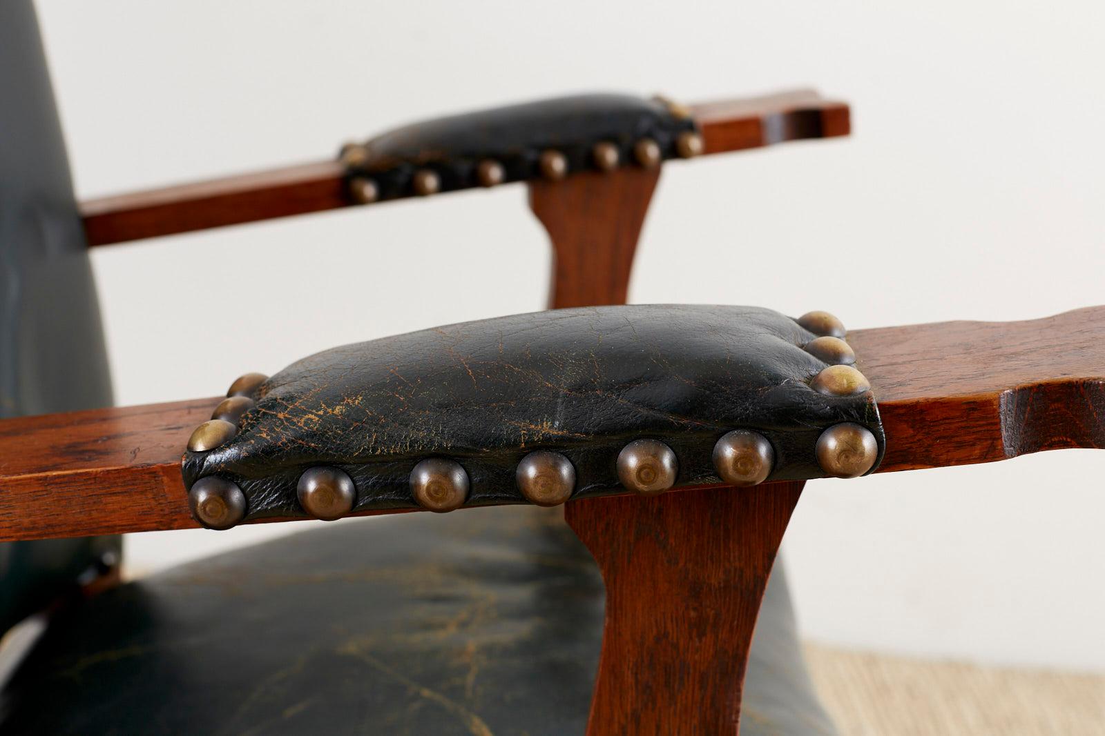 Brass Pair of Spanish Oak and Leather Studded Lounge Chairs