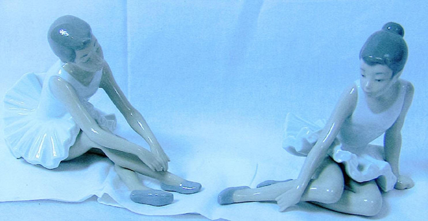 lladro ballerina sitting on floor