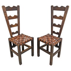 Pair of Spanish Primitive Fireside Chairs With Leather Strapping, Circa 1930s