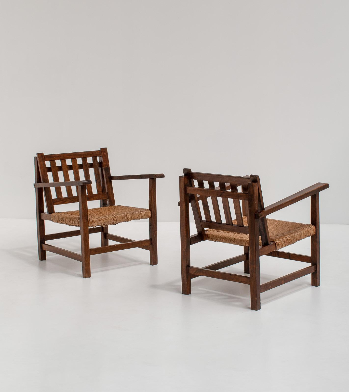 Pair of unique rationalist armchairs, Spain, 1960s by unknown manufacturer.

The beauty of these chairs comes from the straightforwardness of the design. The frame is highly sculptural and architectural, consisting of only straight lines, which is