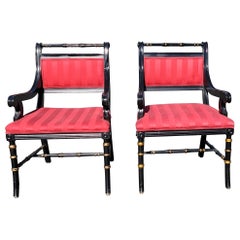 Pair of Spanish Regency Parcel Gilt and Ebonized Upholstered Armchairs