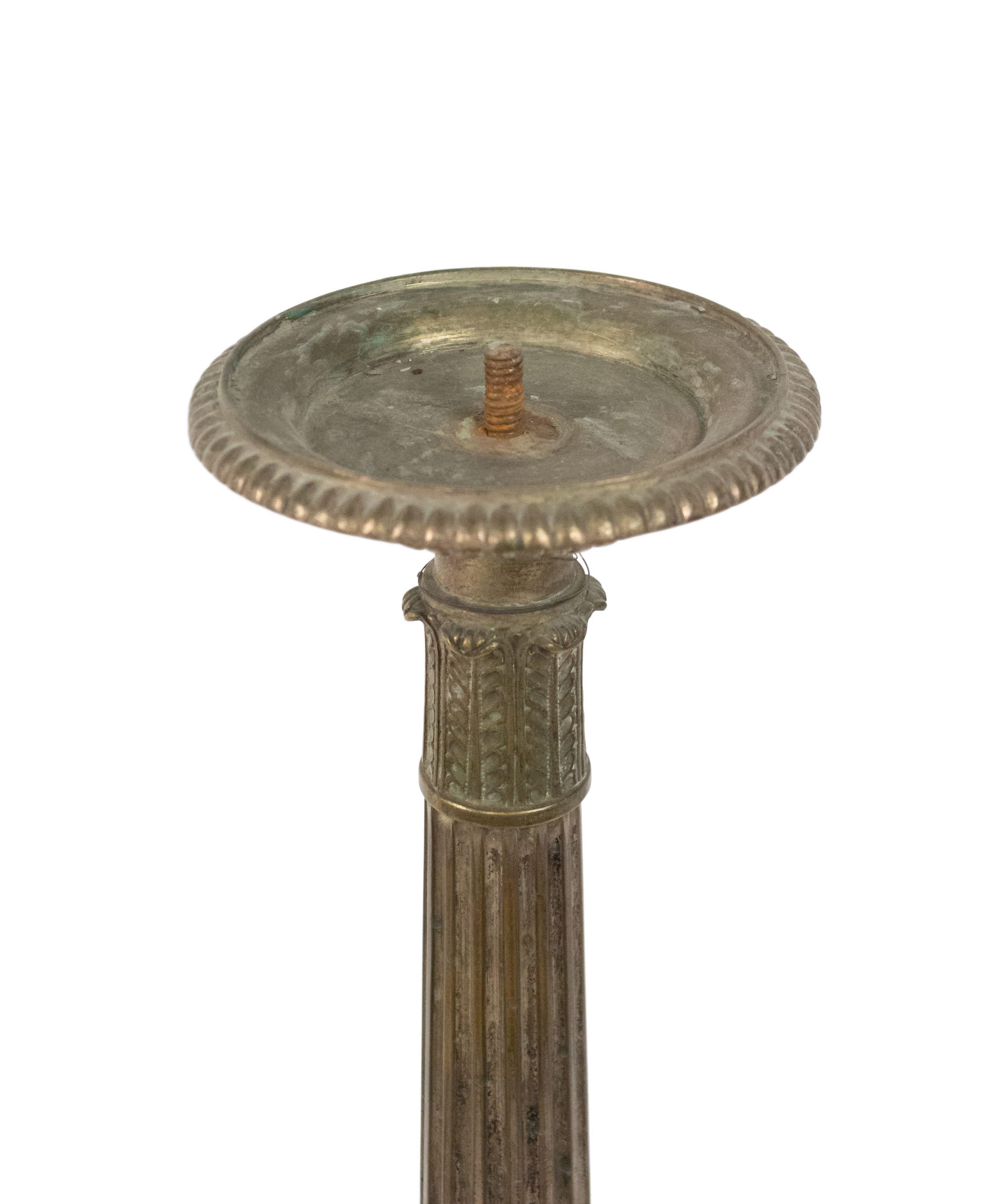 Pair of Spanish Renaissance-style (19th century) style silver plate fluted column altar sticks on tripod base (Priced as pair).
   