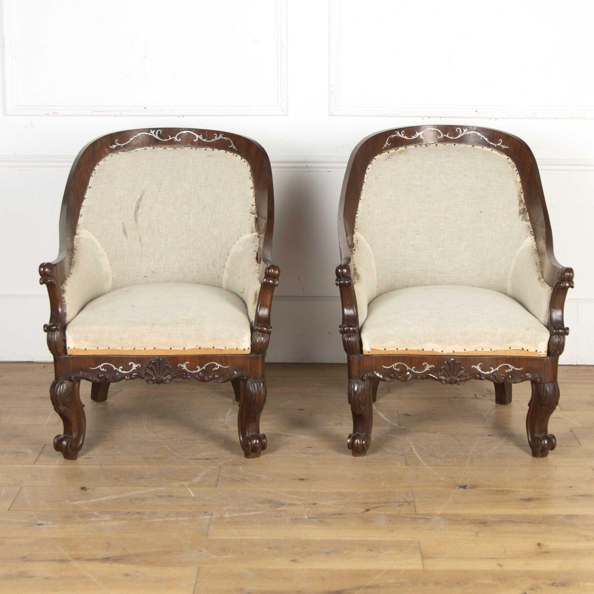 Pair of Early 19th Century Spanish pewter inlaid armchairs.
Dating from the Early 19th Century and of Spanish/Majorca origins, this pair of armchairs is inlaid with pewter and has barrel backs supported on shaped cabriole legs with upturned scroll