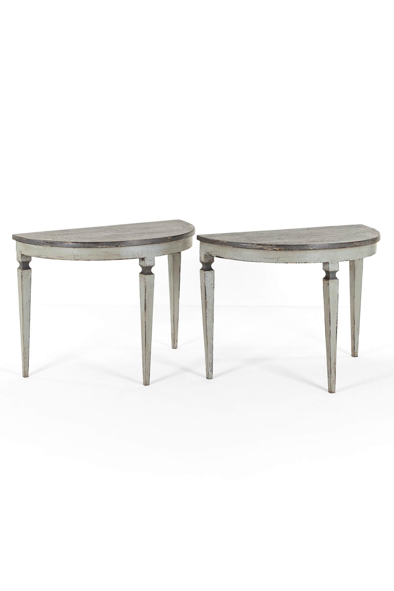A wonderful pair of Demi Lune console tables with thick spacious tops in a pewter coloured finish.

The bases are hand crafted in maritime pine and finished in light grey paint.

Each raised on four gently tapering turned legs.

Price is for the