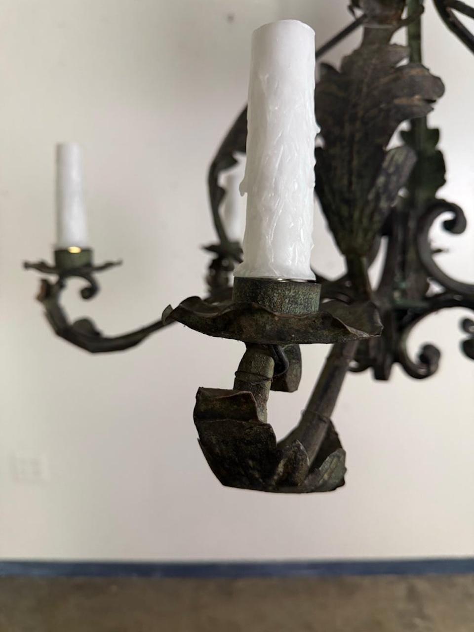 Pair of Spanish Six-Light Wrought Iron Chandeliers In Distressed Condition For Sale In Los Angeles, CA