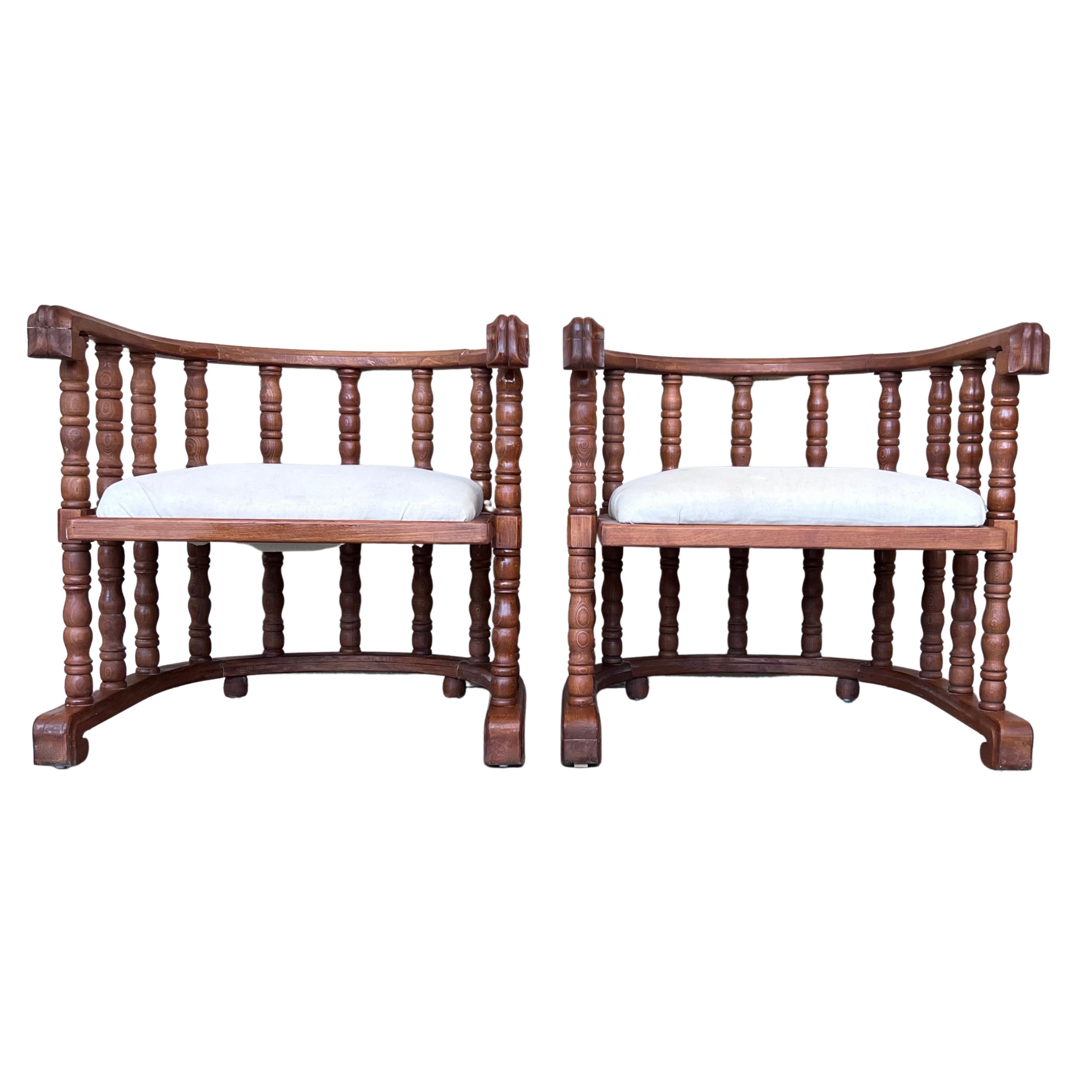 Pair of Spanish Slatted Barrel Back Hand Carved Chairs