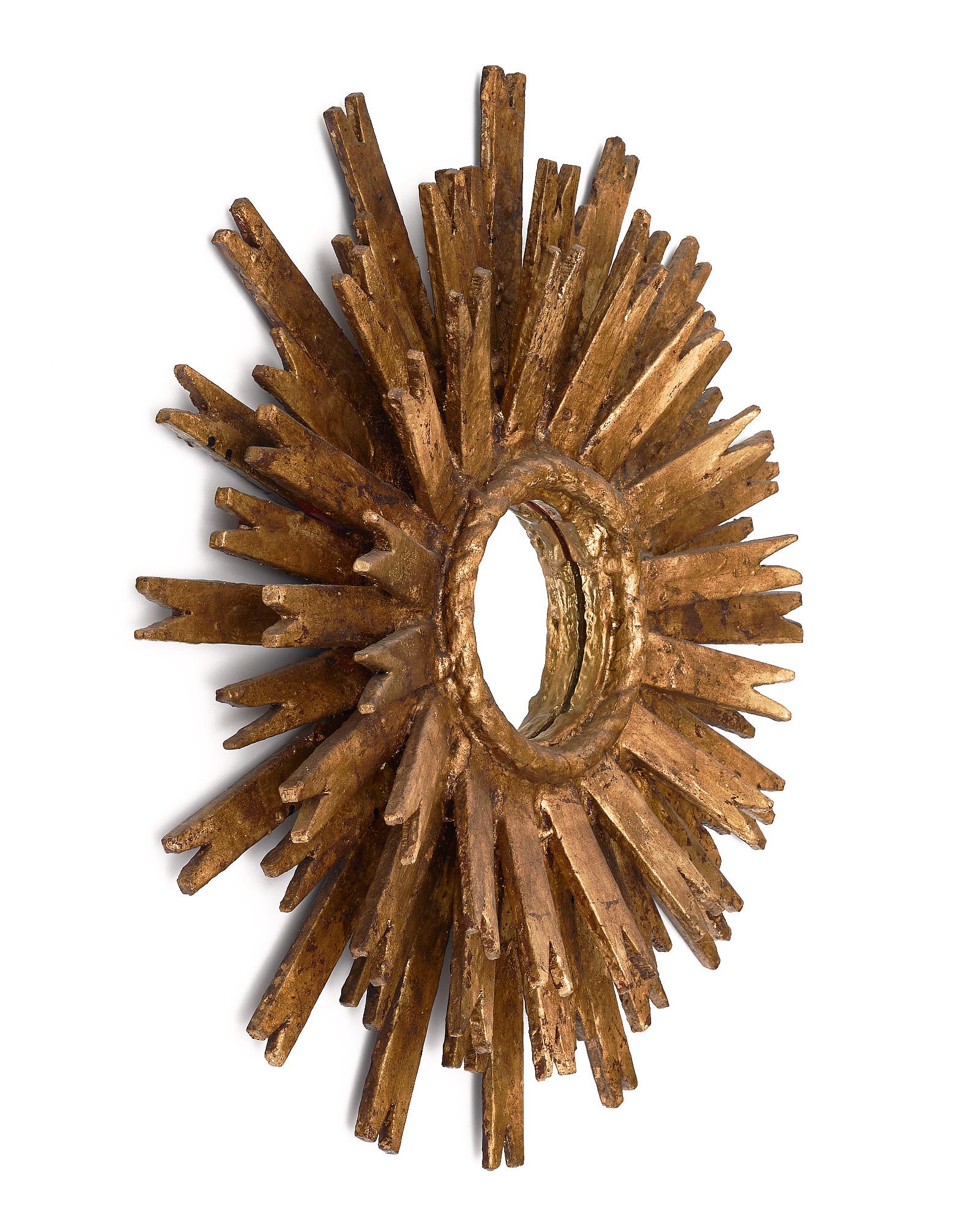 Pair of Spanish sunburst mirrors made of hand-crafted gold leafed wood.
