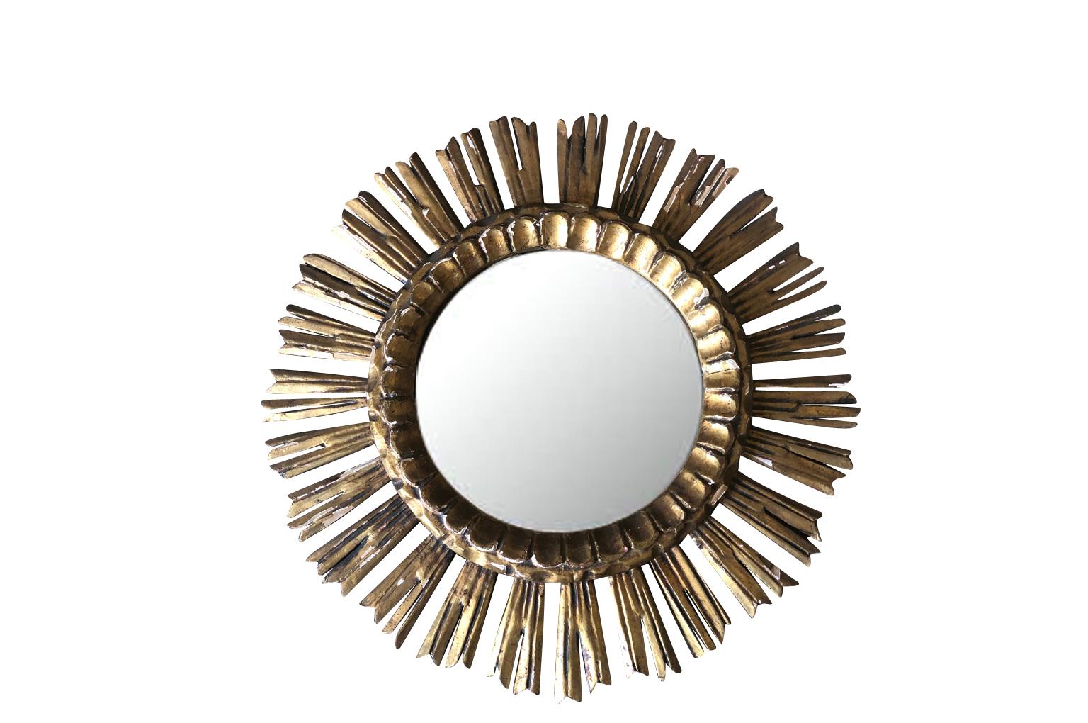 A wonderful pair of hand carved giltwood sunburst mirrors from the Catalan region of Spain. Wonderful accent pieces to add charm to their surroundings.