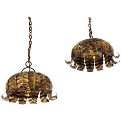 Pair of Spanish Sunburst Pendant Lights in Gilt Iron and Amber Glass