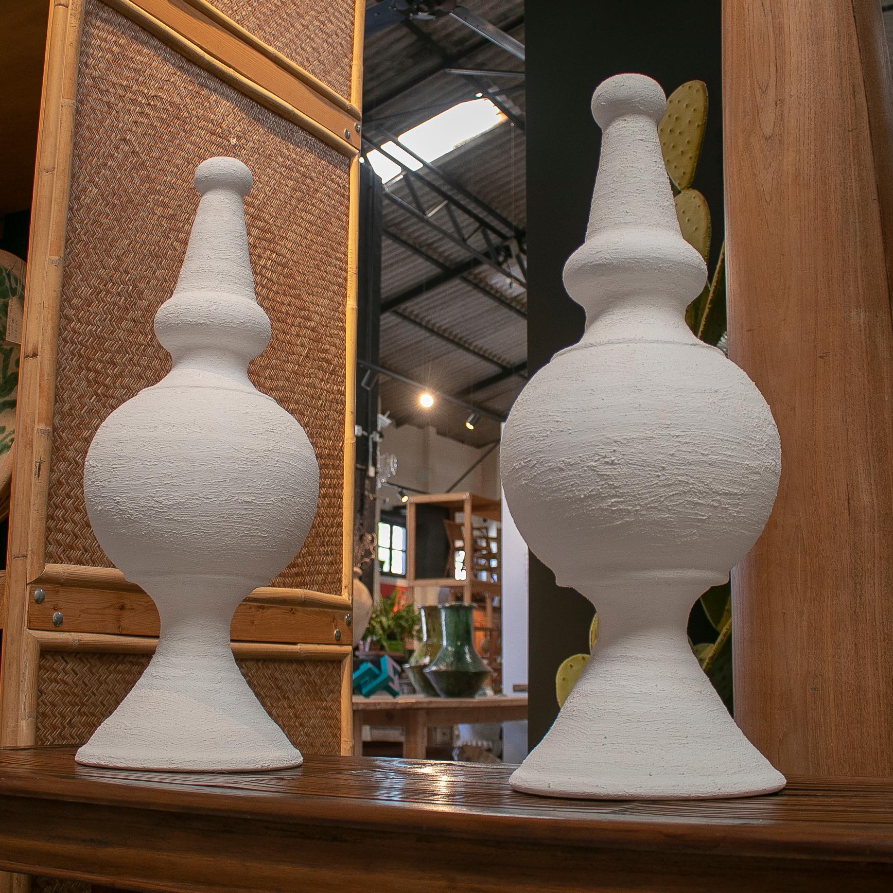 Pair of Spanish white washed terracotta finials.