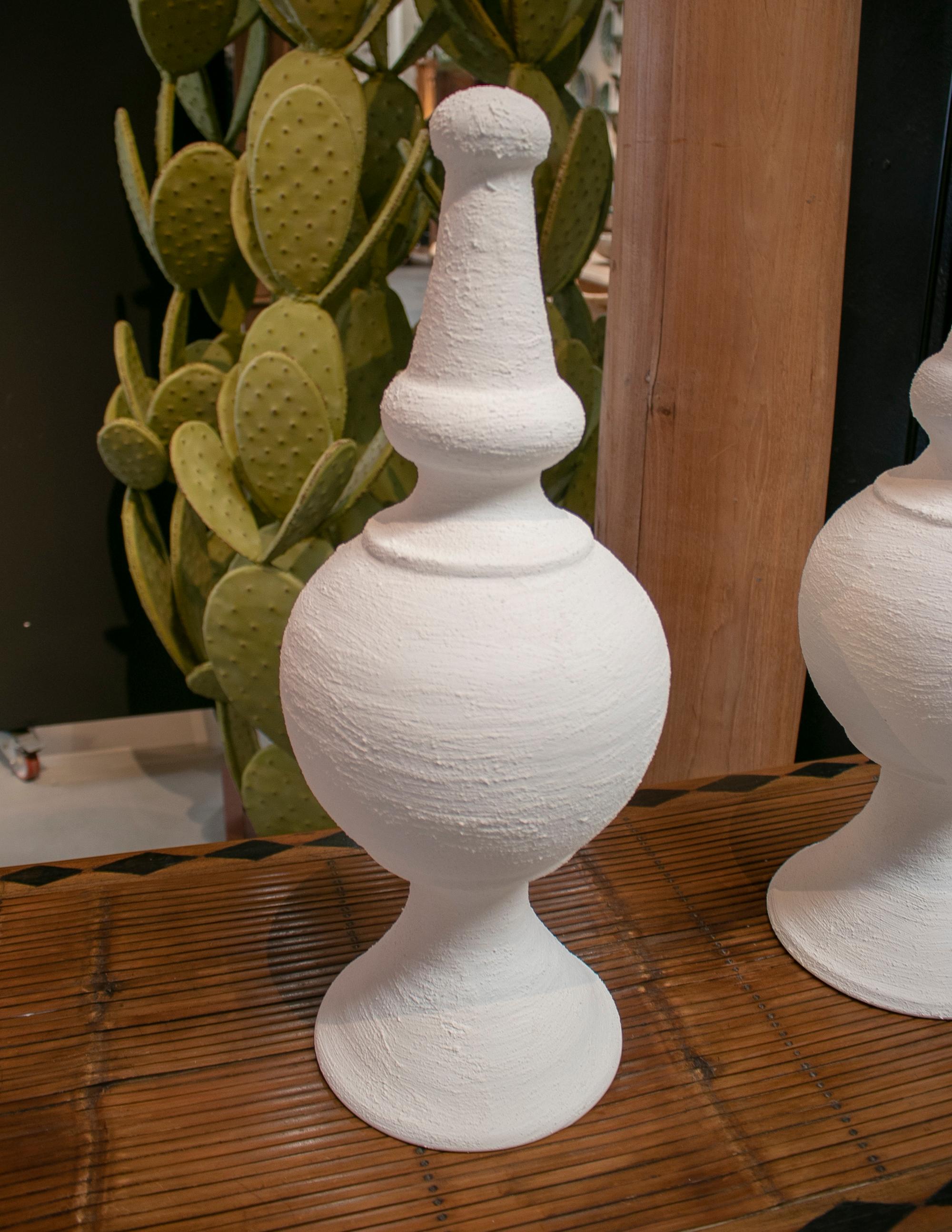 Pair of Spanish white washed terracotta finials.