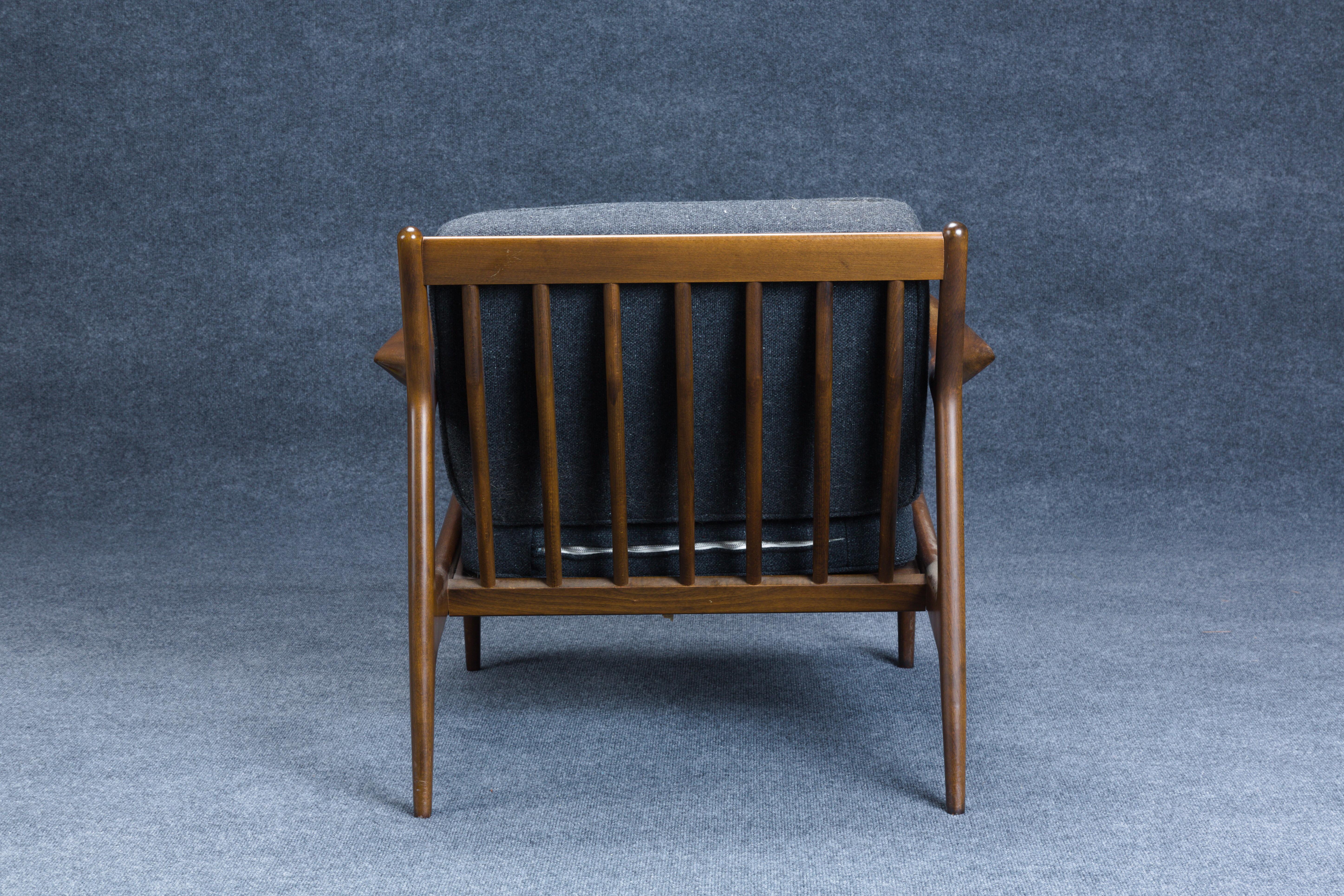 Two Ib Kofod-Larsen (Danish, 1921-2003) for Selig Spear Lounge Chairs, Denmark, c. 1960, walnut, brass, steel, each with round Selig tag, ht. 26 1/2, wd. 30, dp. 30 in.