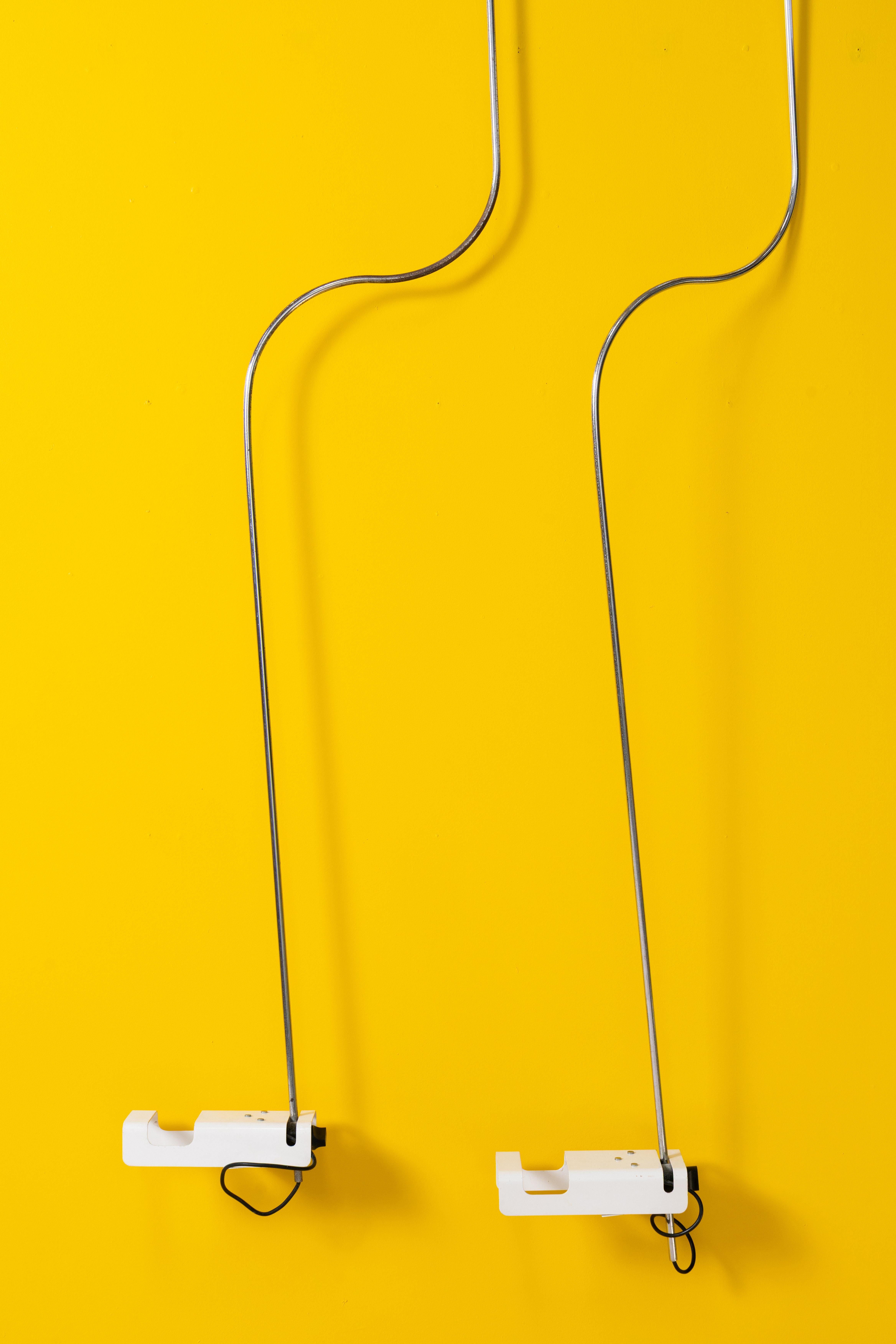 Pair of Spider ceiling lamps designed by Joe Colombo, a key figure of Italian design in the 1960s known for his futuristic and innovative approach.