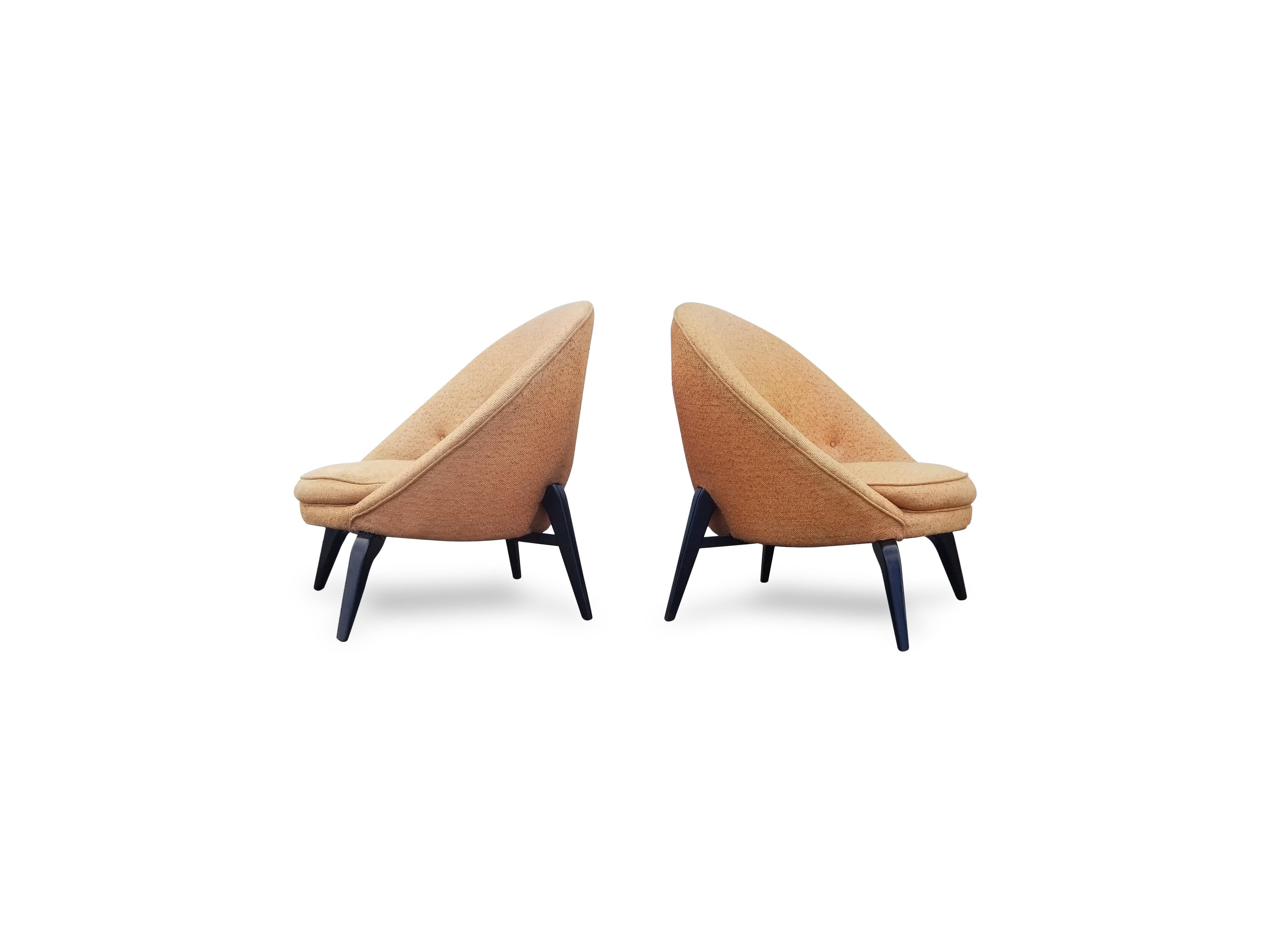 Pair of spider leg lounge chairs in the style of Jean Royère.
