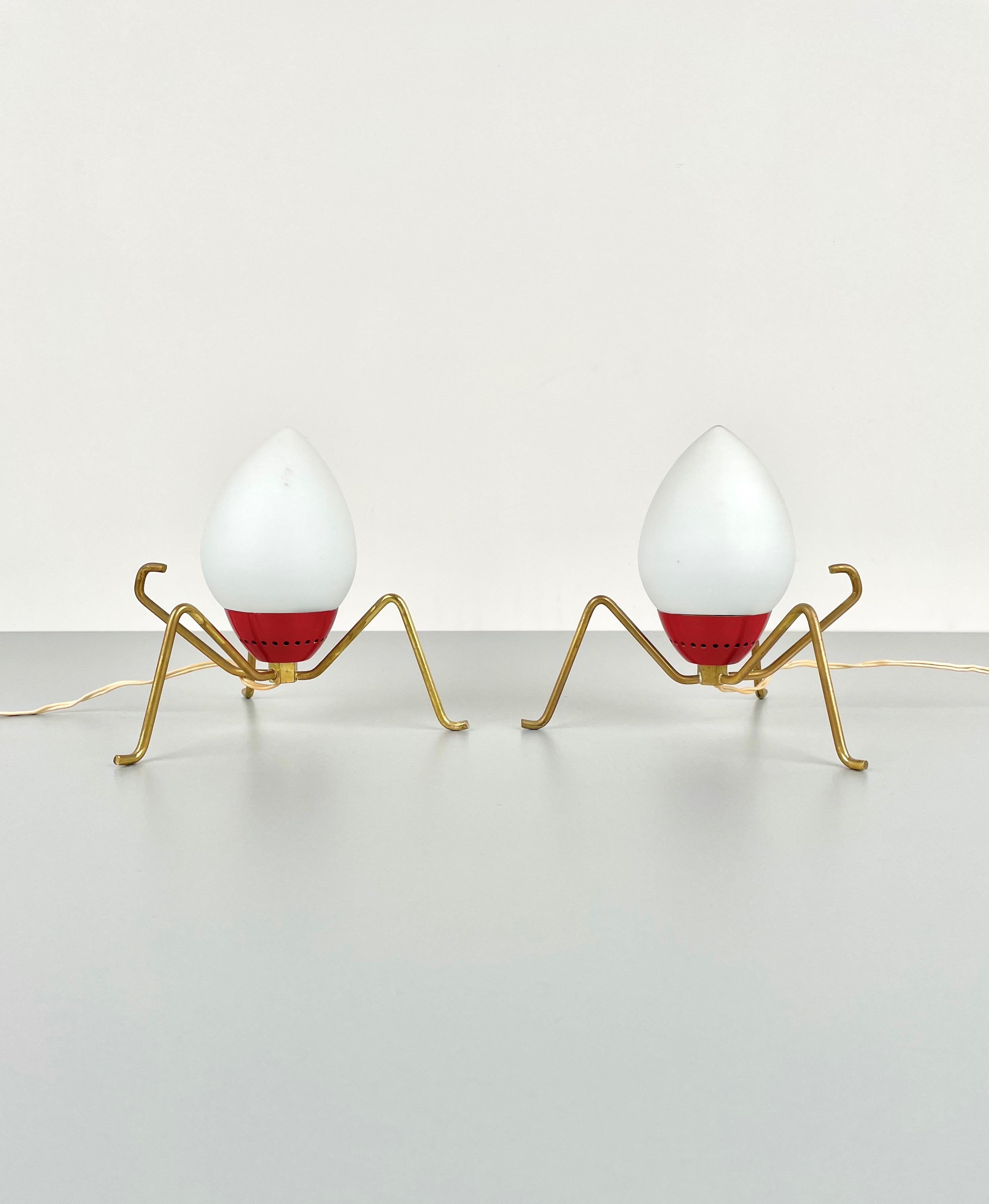Pair of 1950s table lamps in opaline glass with brass feet that resemble spider's legs in the style of Stilnovo, Italy.
