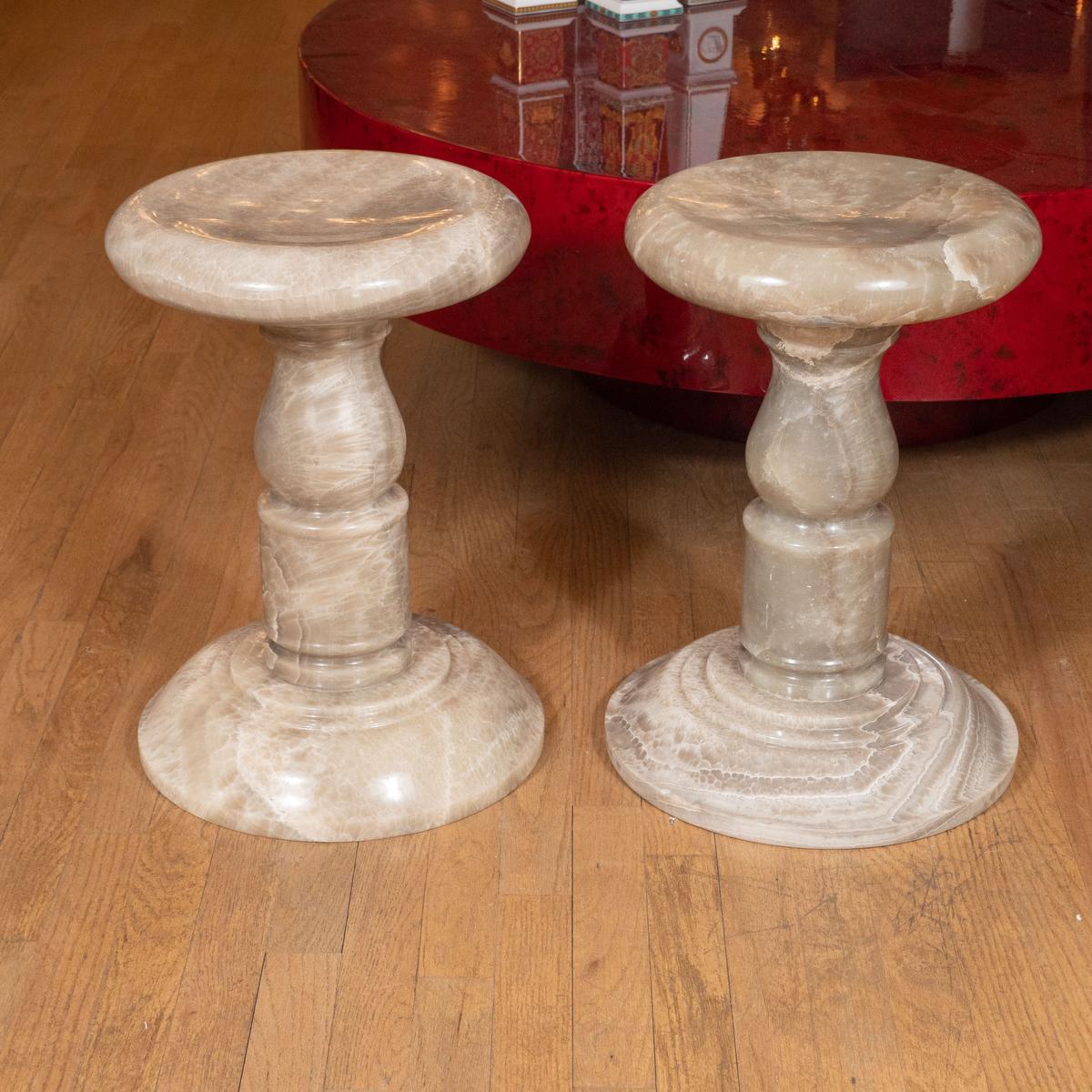 Pair of spindle form onyx stools.