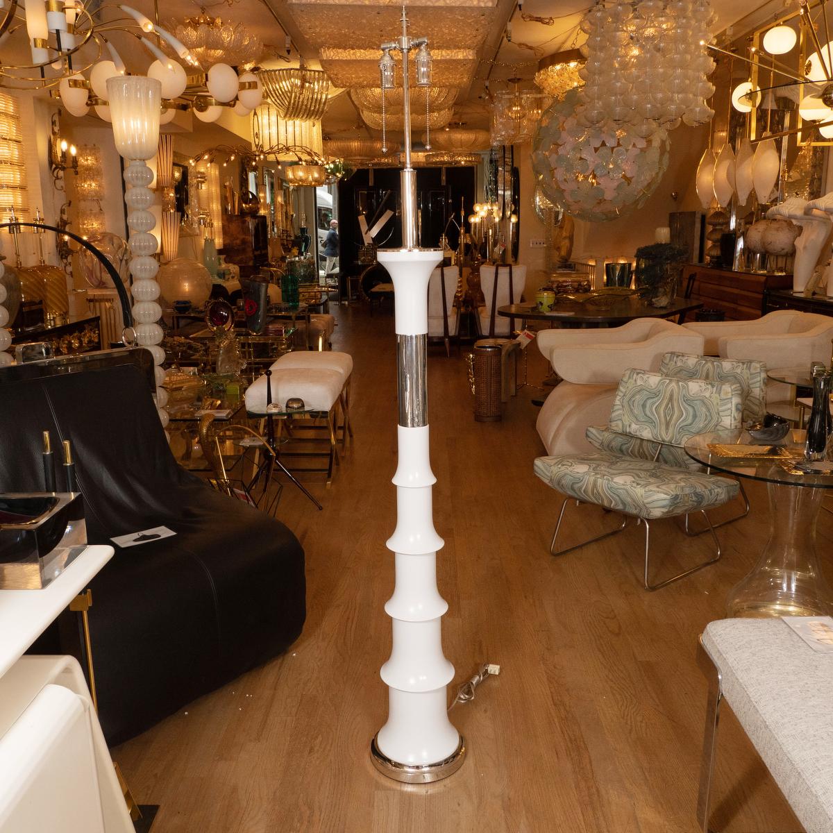 Pair of spindle form white lacquered metal and chrome floor lamps.
