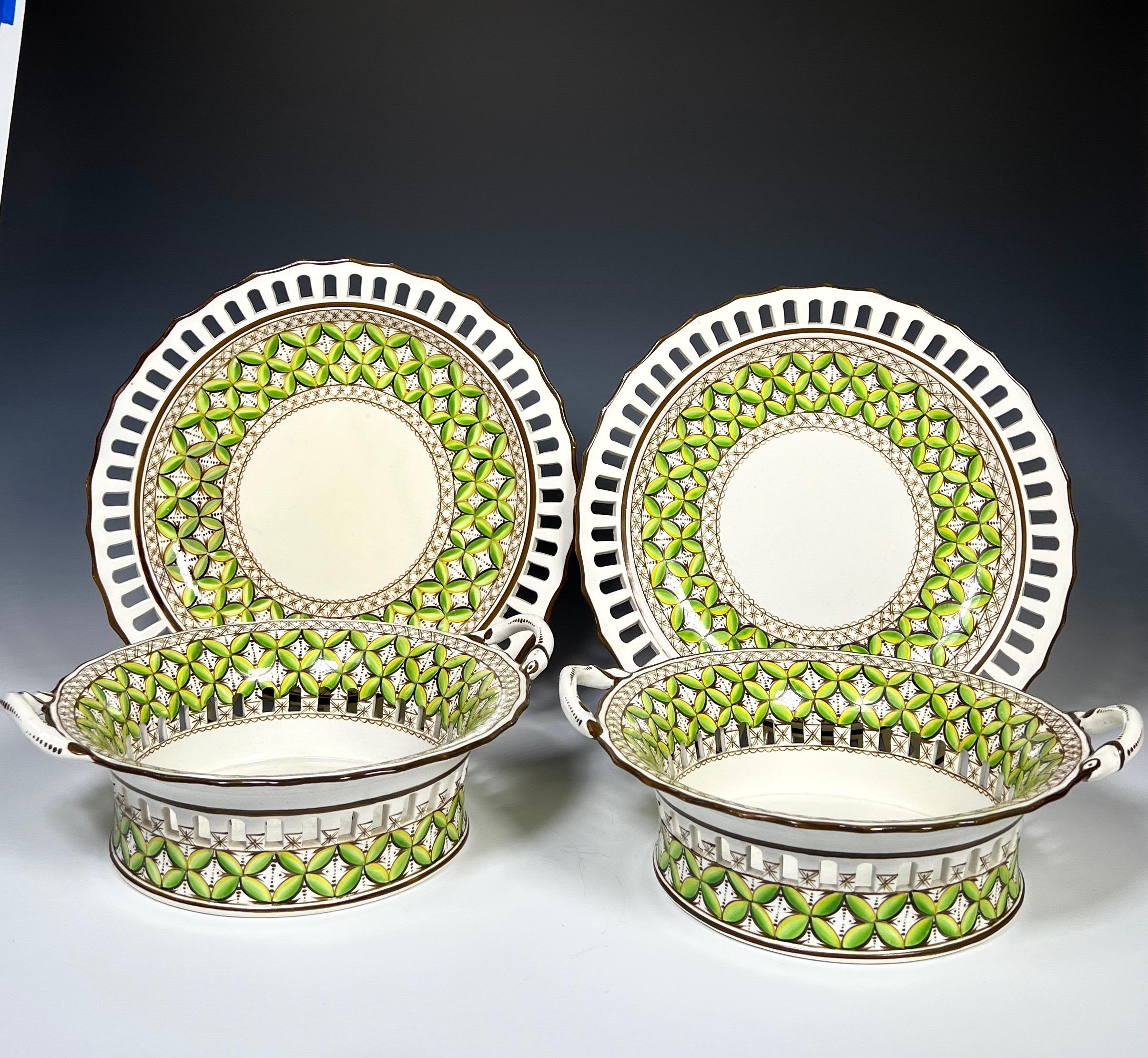This pair of rare 19th c Spode Chestnut bowls are in amazing original condition and feature a green enamel leaf motif with pierced border. Each has two handles and basketweave on both the baskets and the matching under plates. Retailed later by