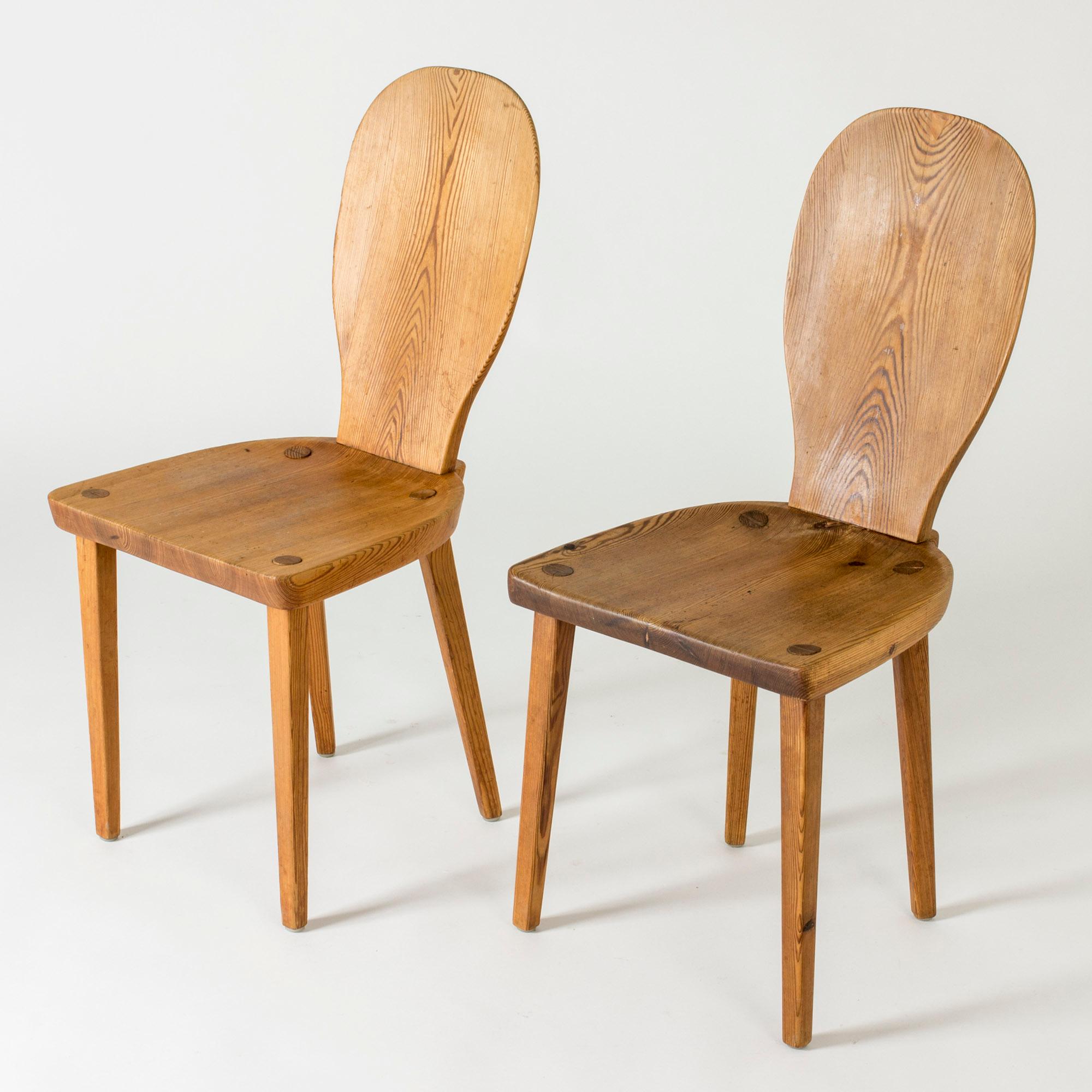 Pair of “Skedblad” dining or side chairs by Carl Malmsten, made from teak. Designed in 1931. Clean form with rustic woodgrain.