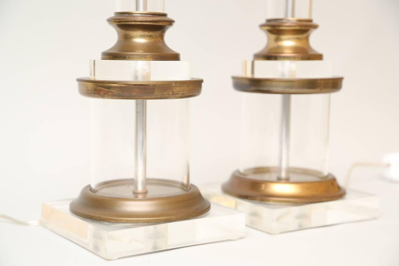 Hollywood Regency Pair of Lucite and Brass Columnar Lamps