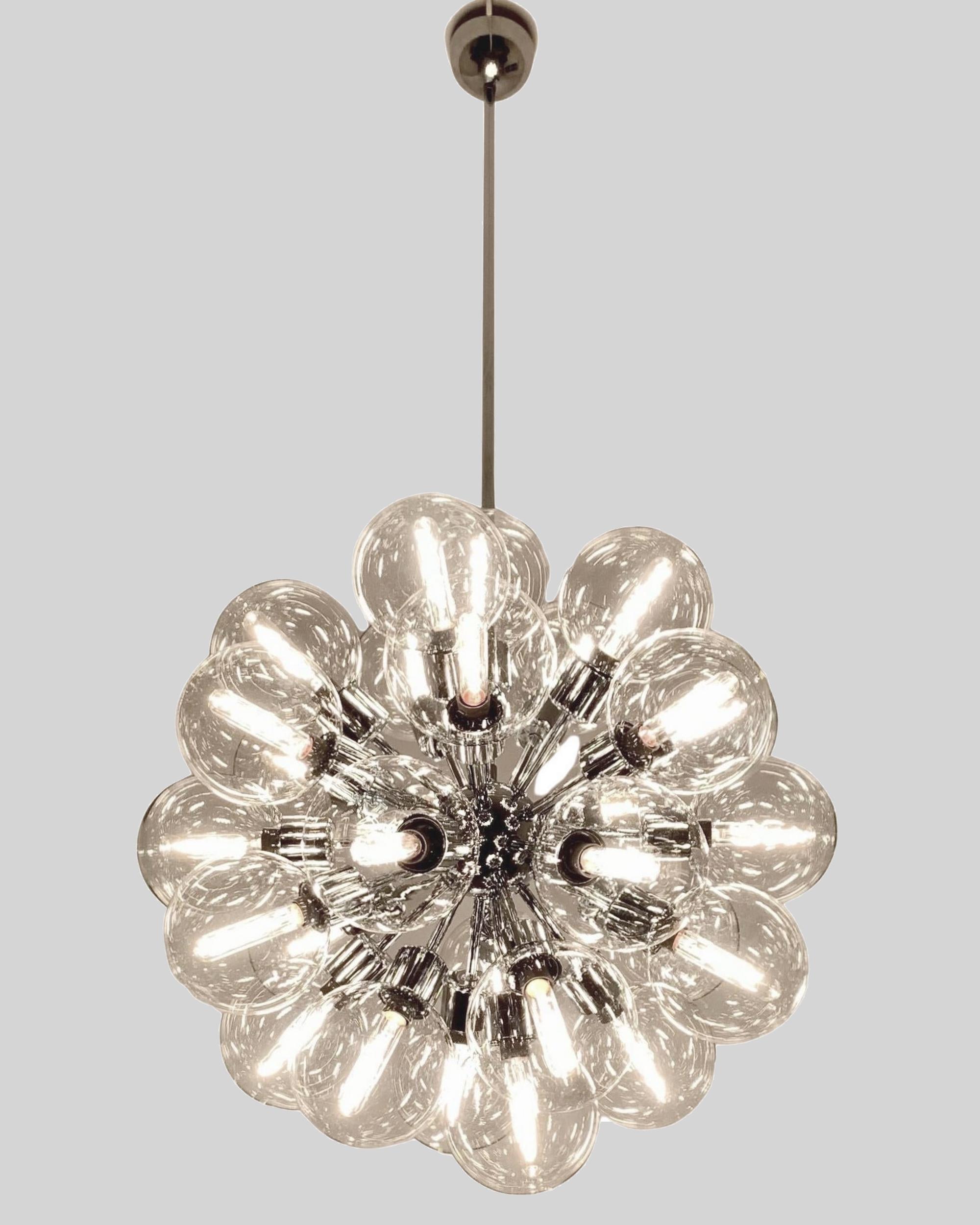 Pair of chandeliers designed by Motoko Ishii and produced by Staff Leuchten in Germany, distributed by Lightolier in the USA.
Twenty-eight original blown glass globes and chromed metal structure.
Can be sold separately.