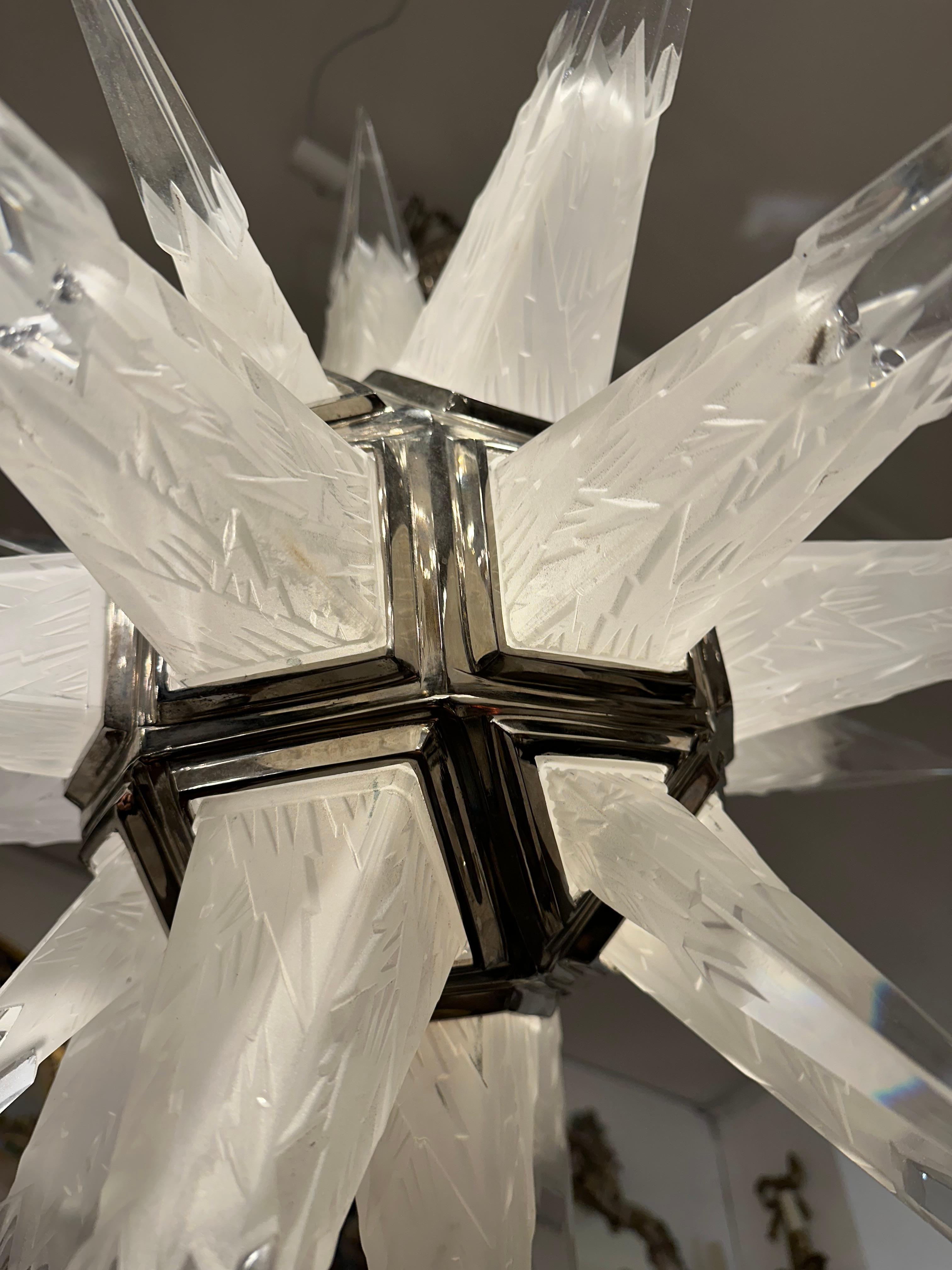 A striking, highly decorative pair of rare rock crystal ceiling lights with detailed etching along each crystal spike. Exceptional lights that would be sure to create a real talking point. The lights can be re-wired according to the countries